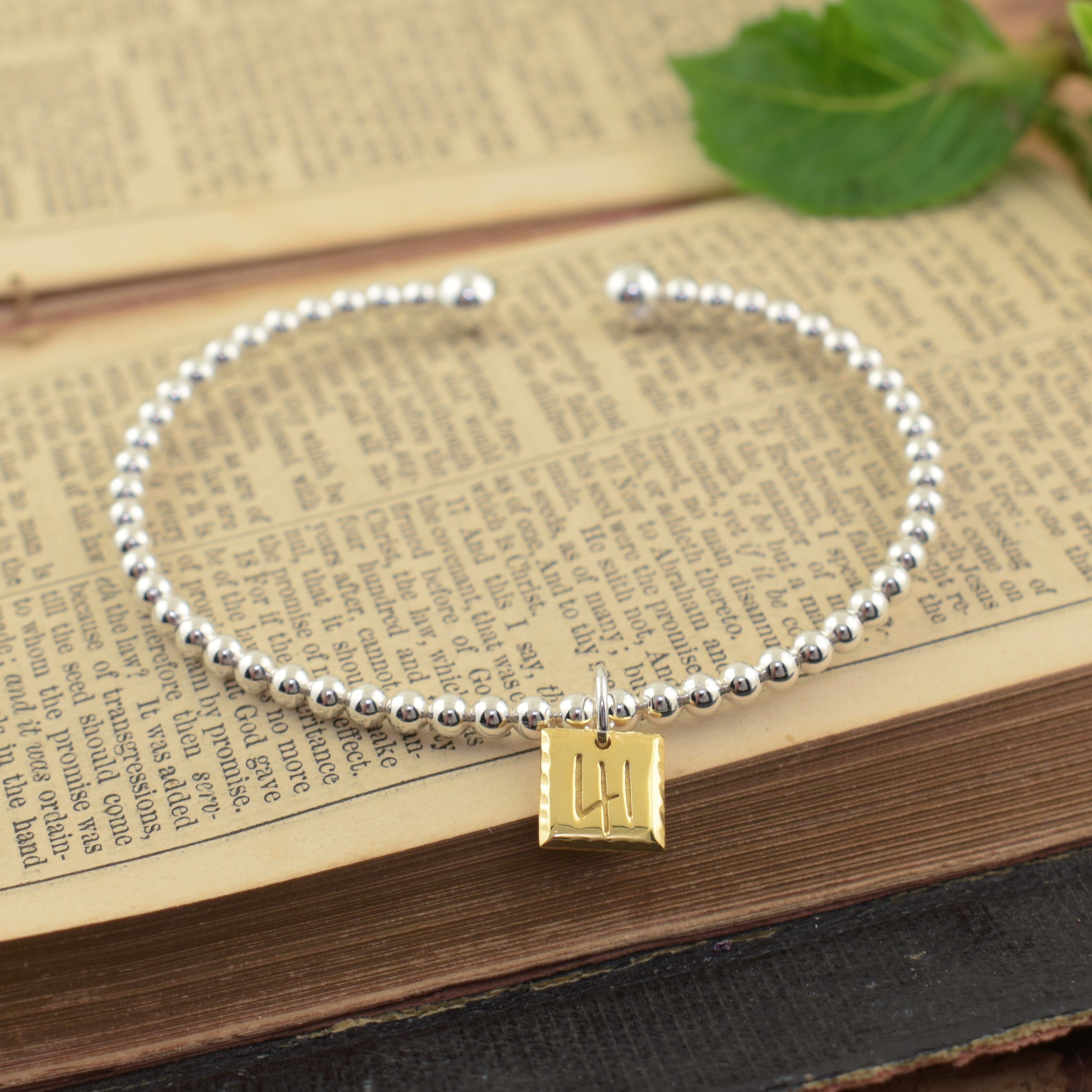 Two-toned sterling silver cuff bracelet with 41 bible reference