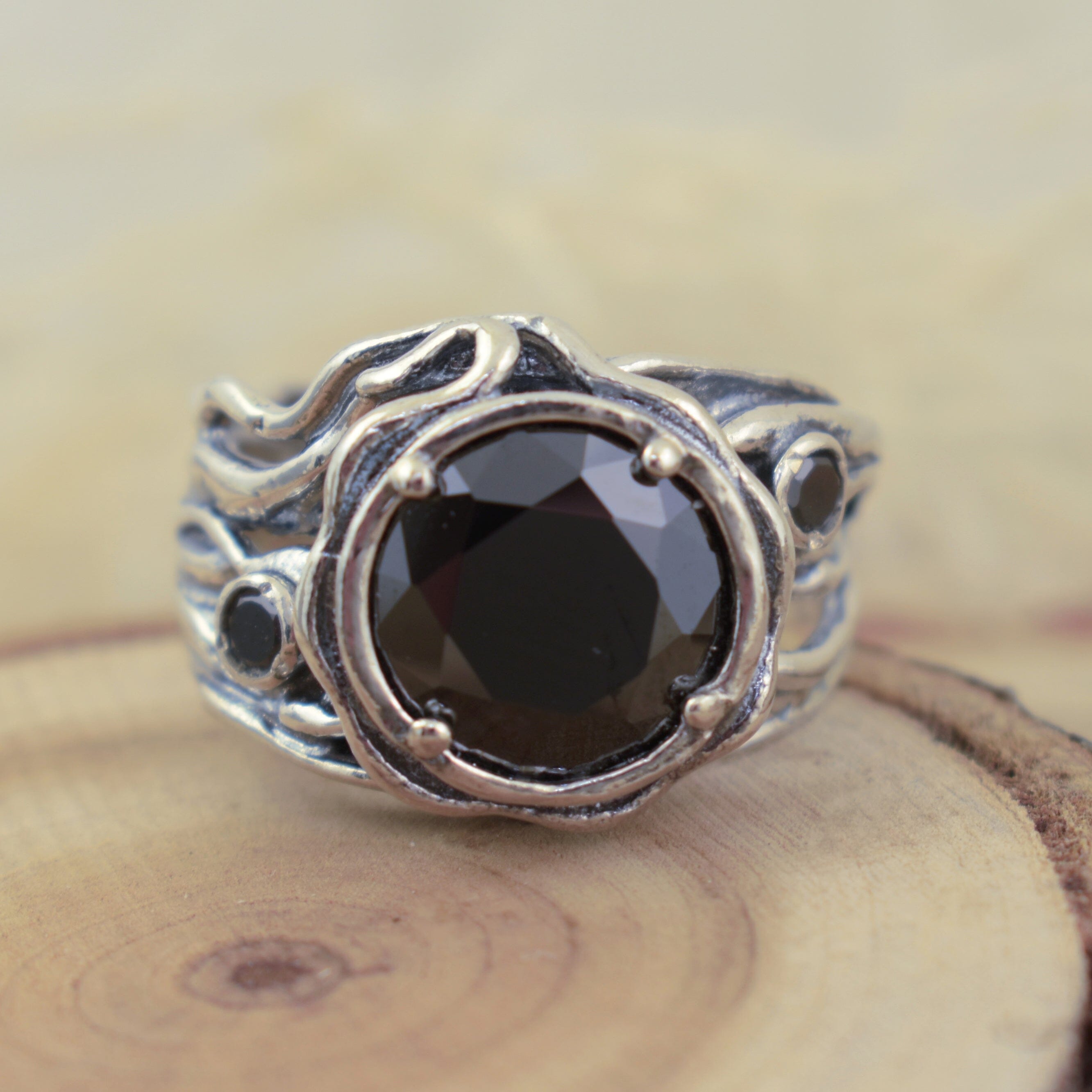 Designer sterling silver ring featuring round black cubic zirconia stones