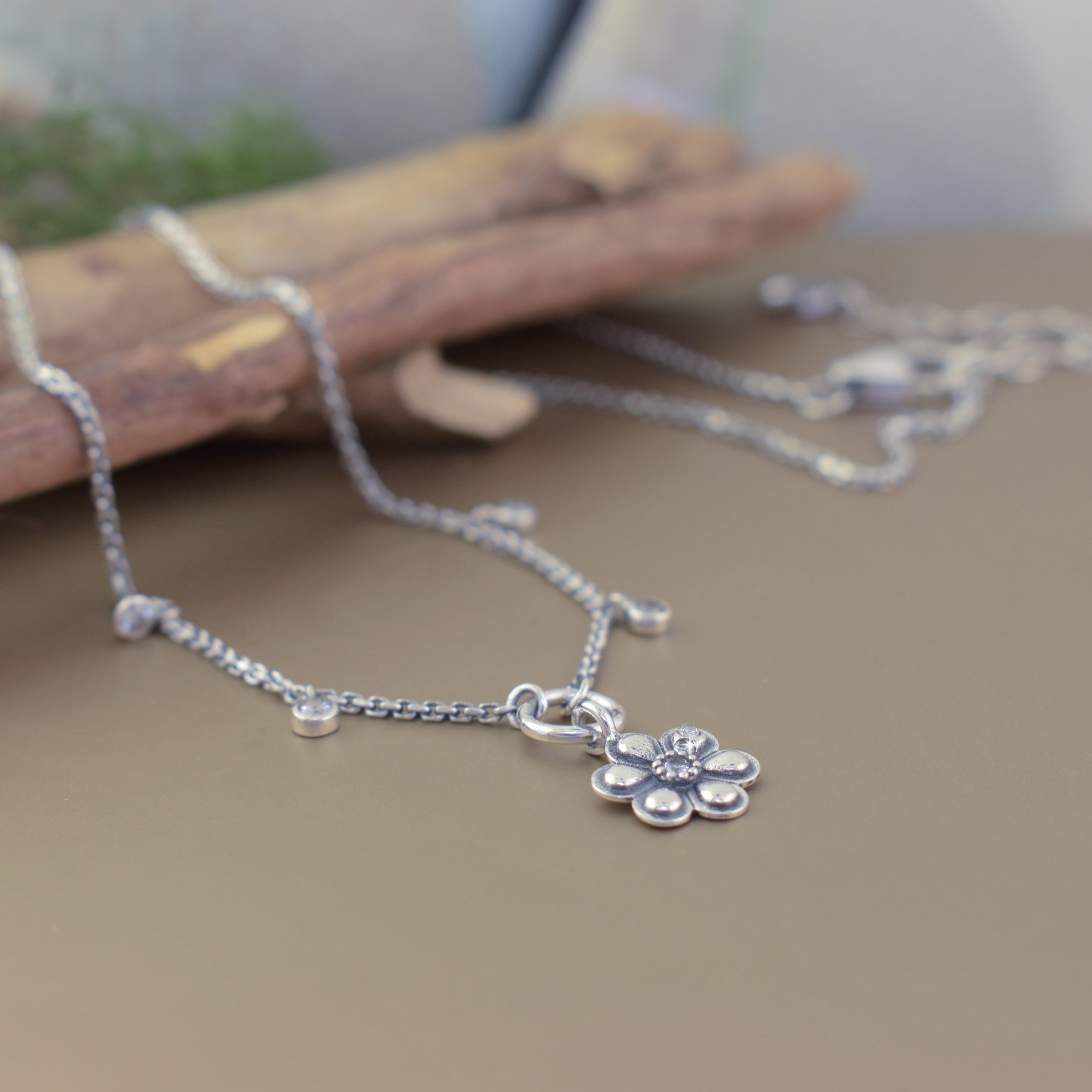 sterling silver cz flower necklace with an oxidized finished