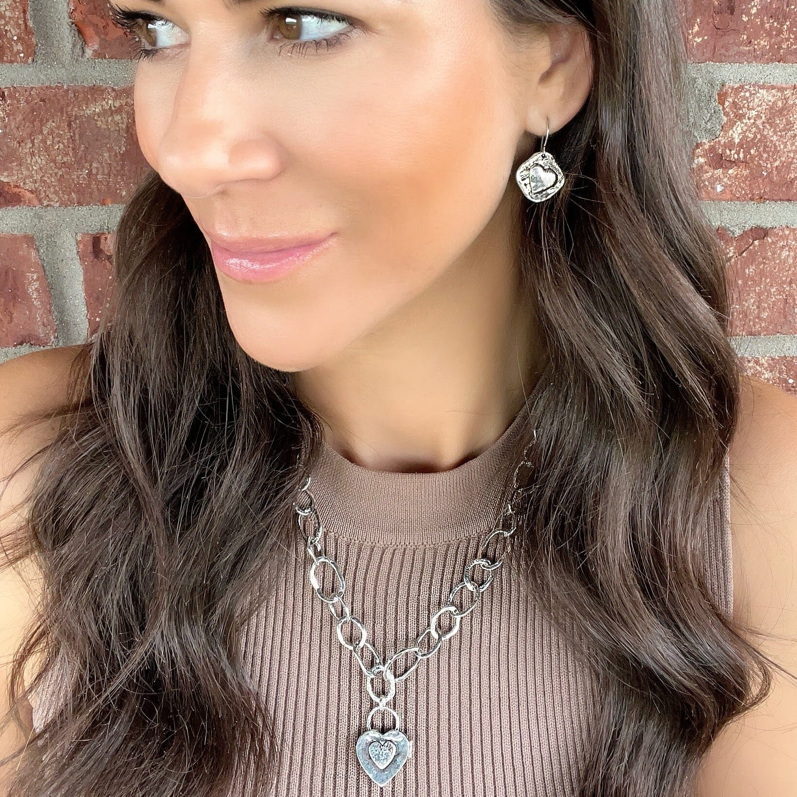 sterling silver handcrafted earring with a  engraved heart