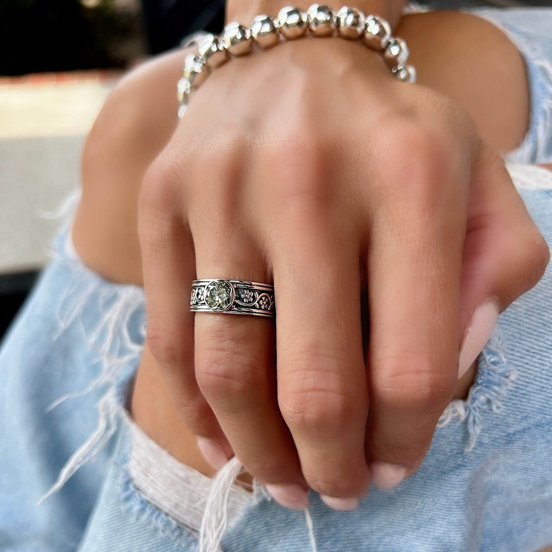 .925 silver ring with a flower detail band and cz stone