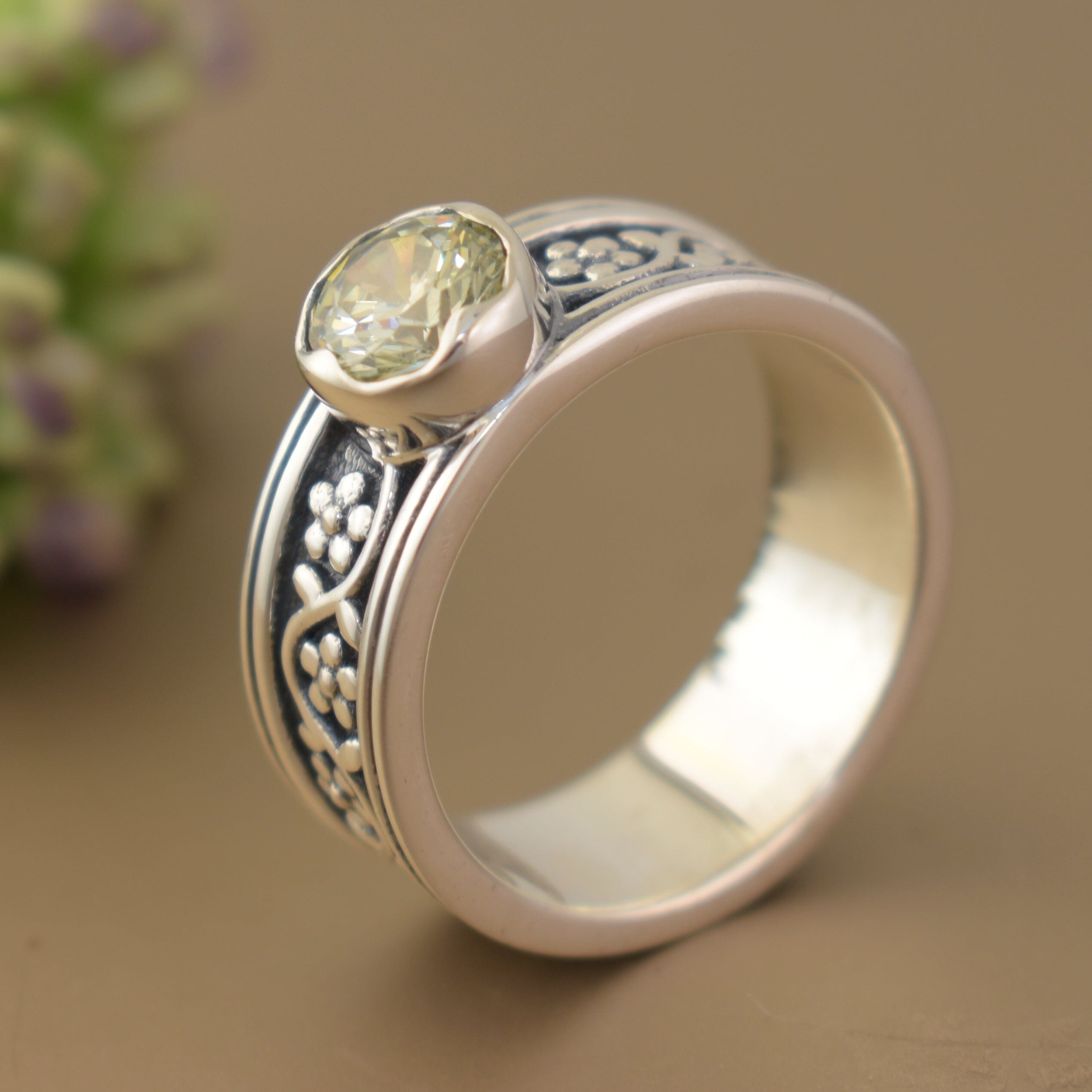 Flower sterling silver ring featuring round green CZ stone
