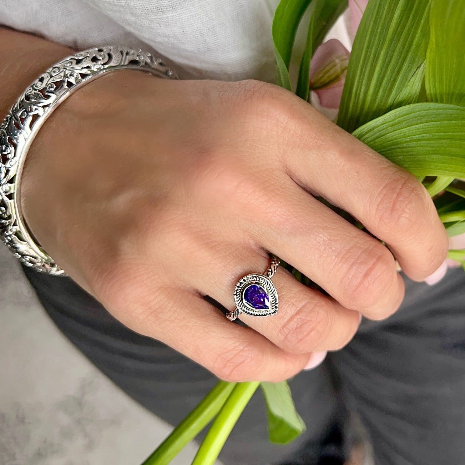 teardrop shaped purple cz ring with oxidized and high polished finish