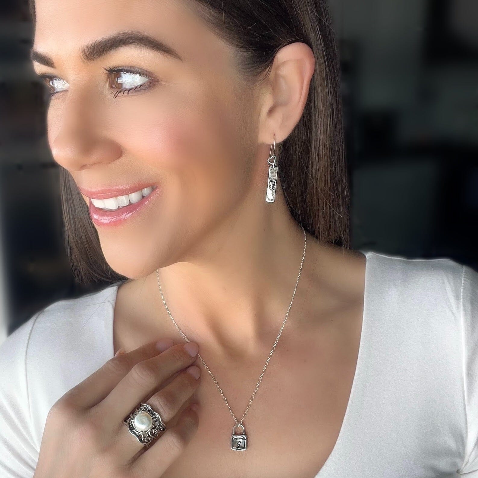 .925 silver long earring with a raised heart paired with initial keeper necklace and the Elsa ring
