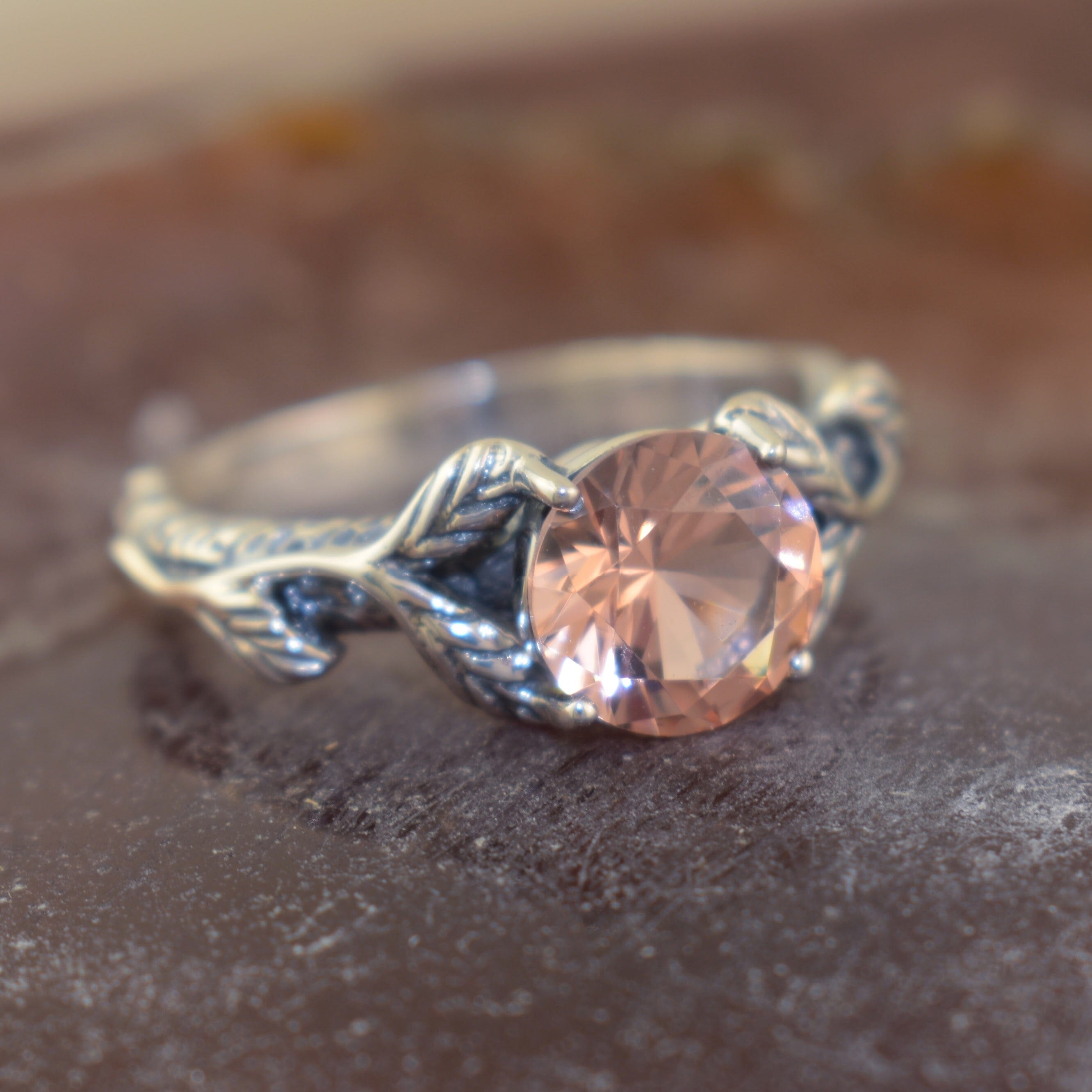 Sterling silver leafy band ring featuring round morganite stone
