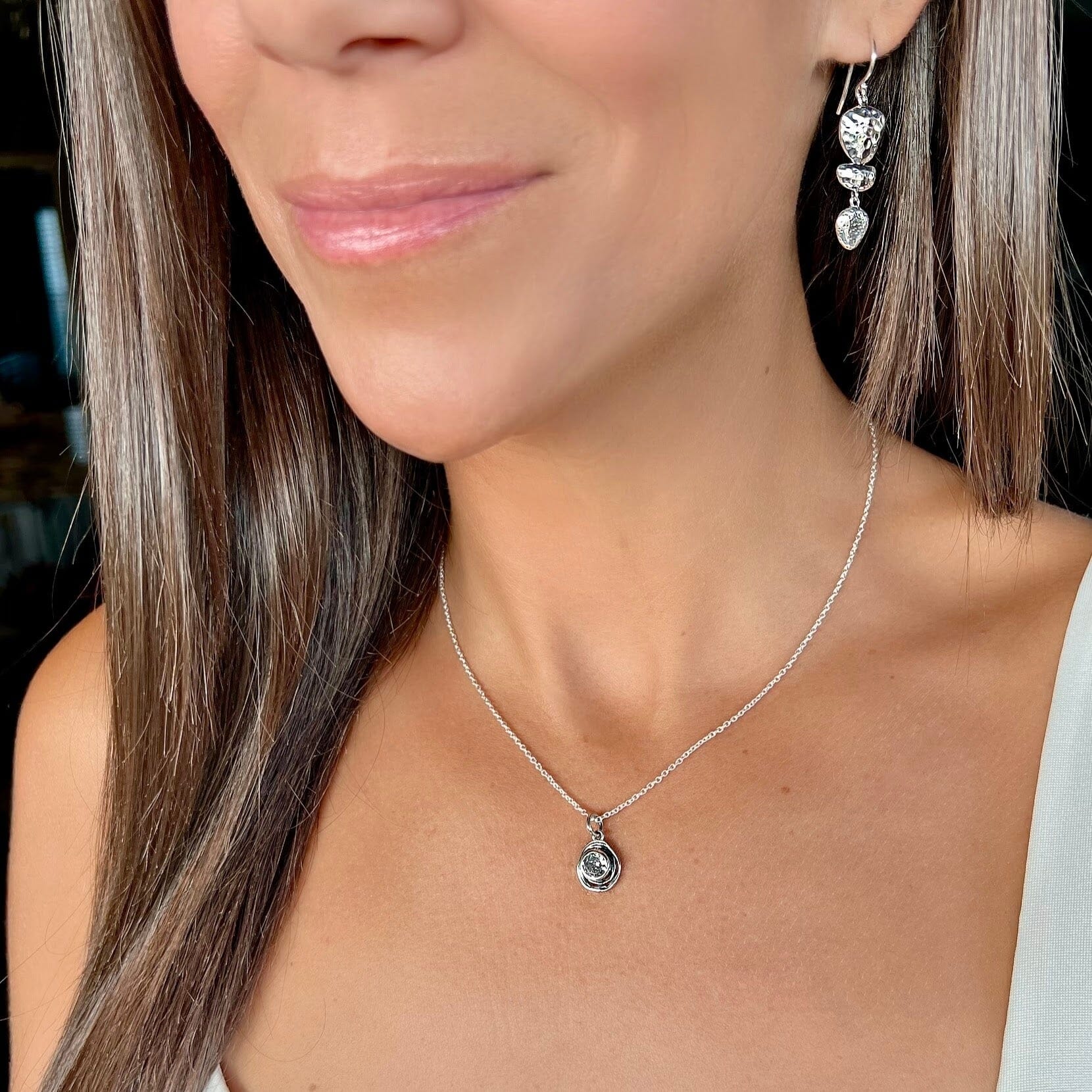 Sterling silver necklace with a spiral pendant featuring a Cubic Zirconium stone