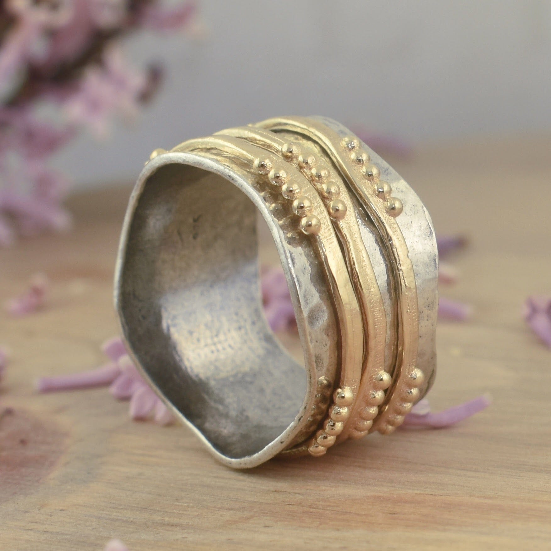Two-toned sterling silver and gold vermeil spinner band ring