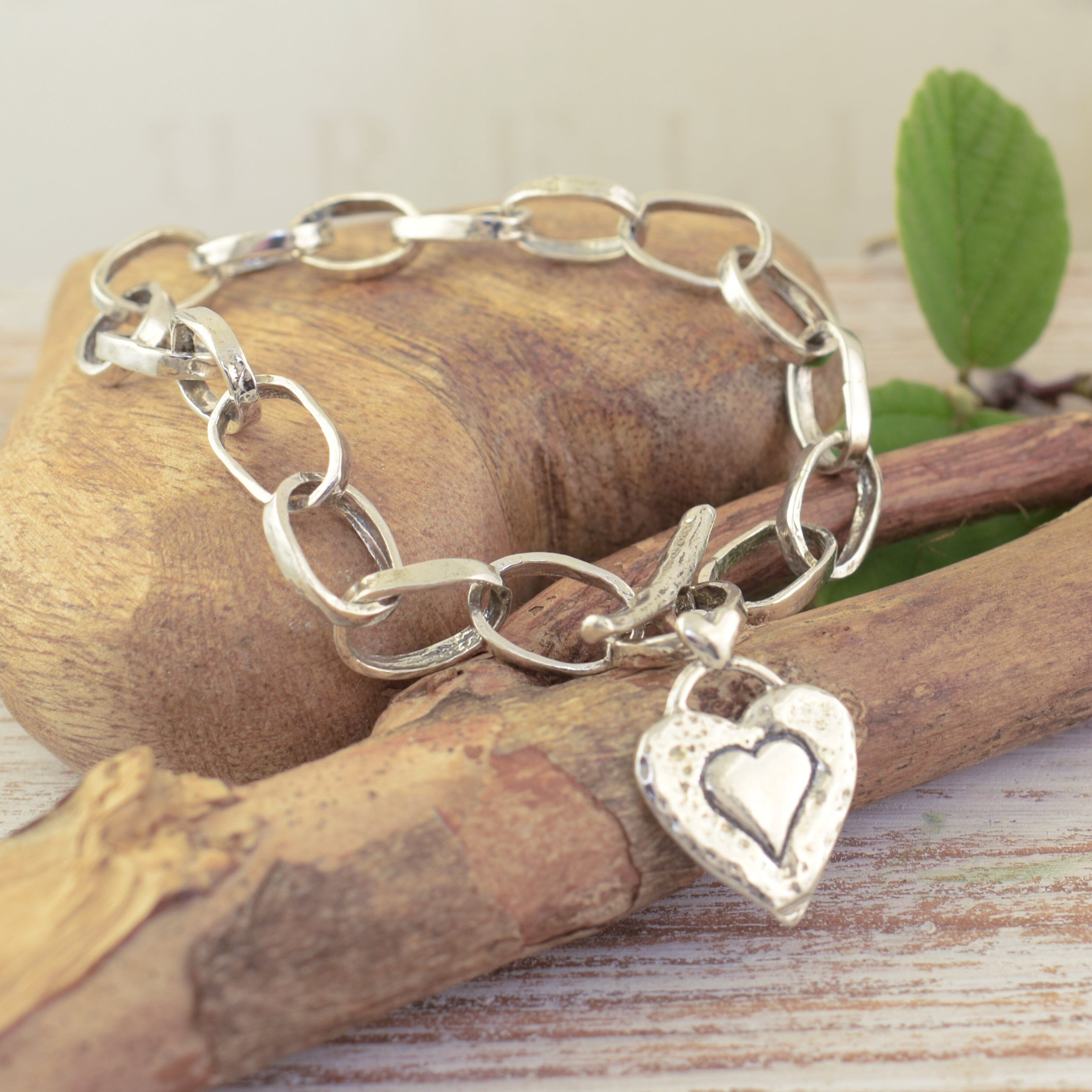 Large link toggle tyle bracelet with antiqued sterling silver heart dangle