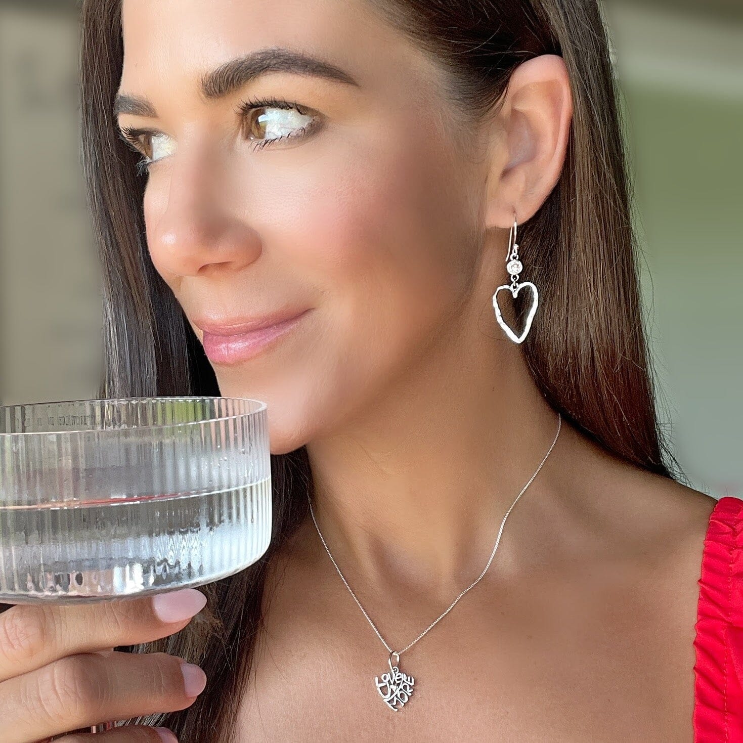 Hammered heart earrings with a CZ dangle paired with love you more