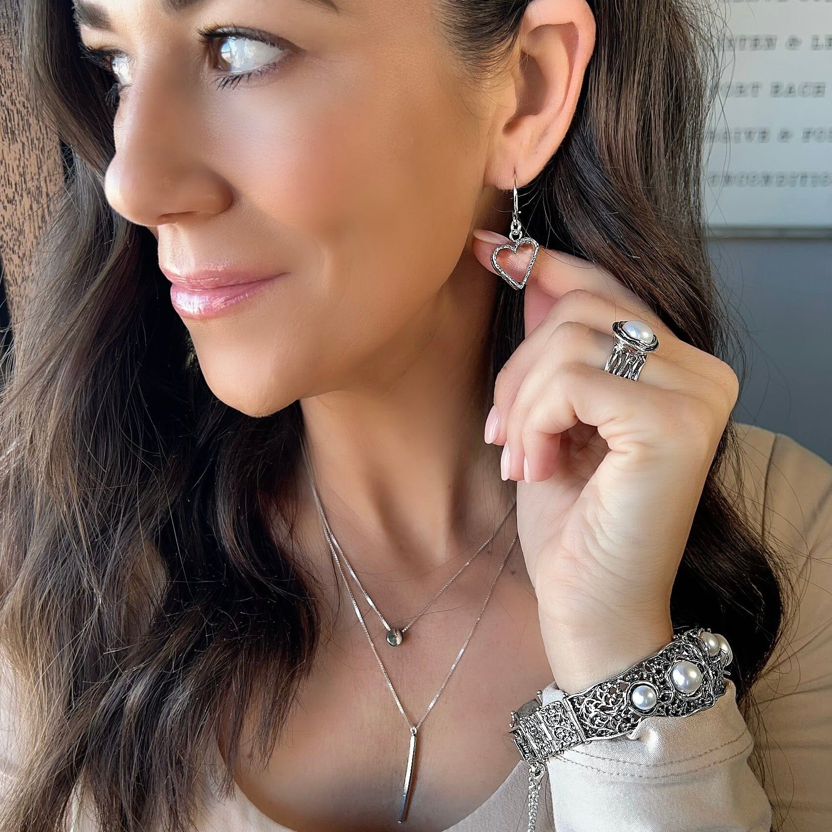hand stamped heart and sun silver earring paired with the better together neckalce and fabulous bracelet and Ella ring