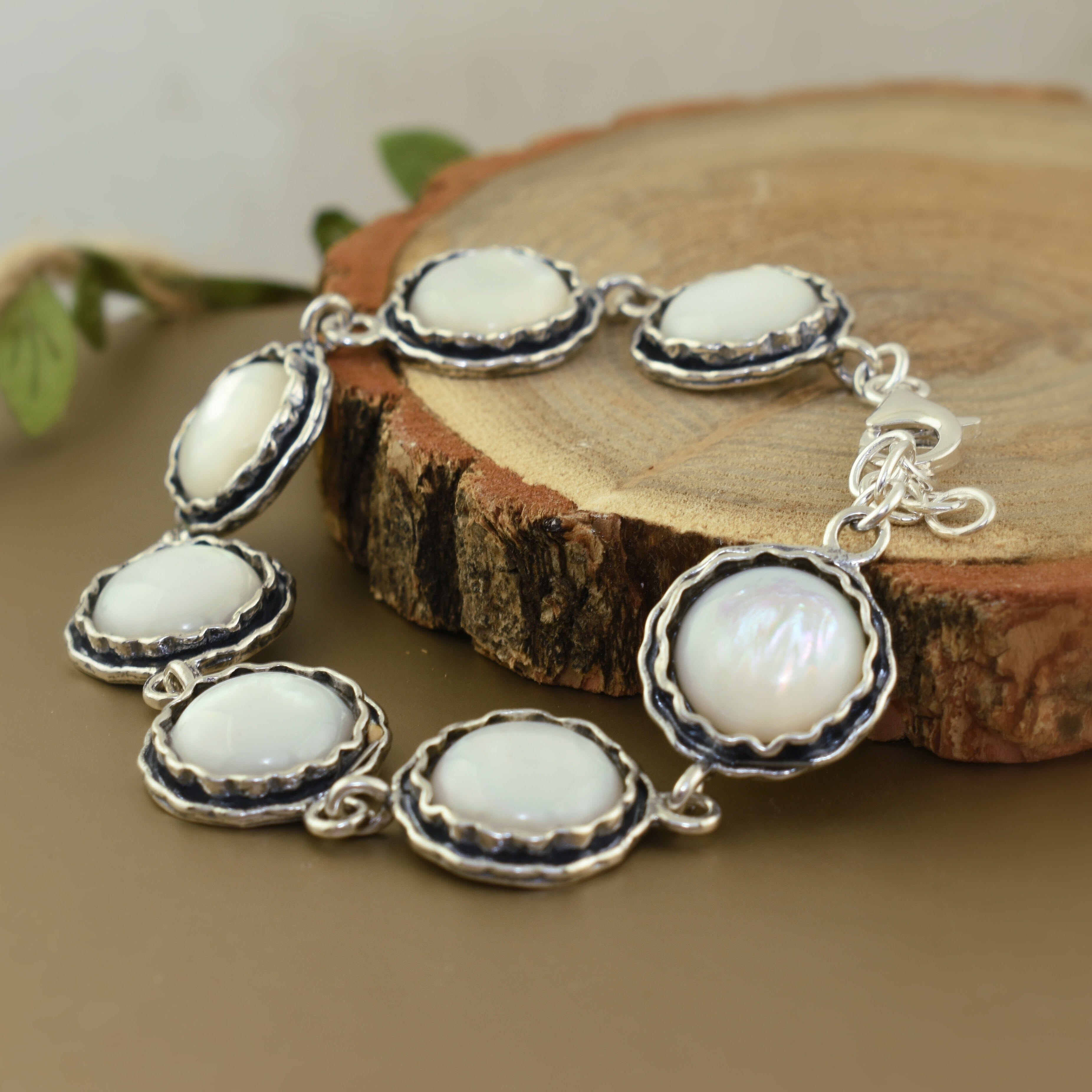 Sterling silver statement bracelet with round mother-of-pearl stones