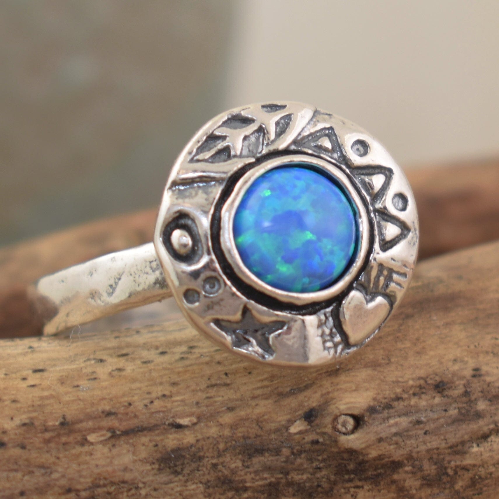 Round .925 sterling silver designer-inspired ring featuring blue-green reconstructed opal stone