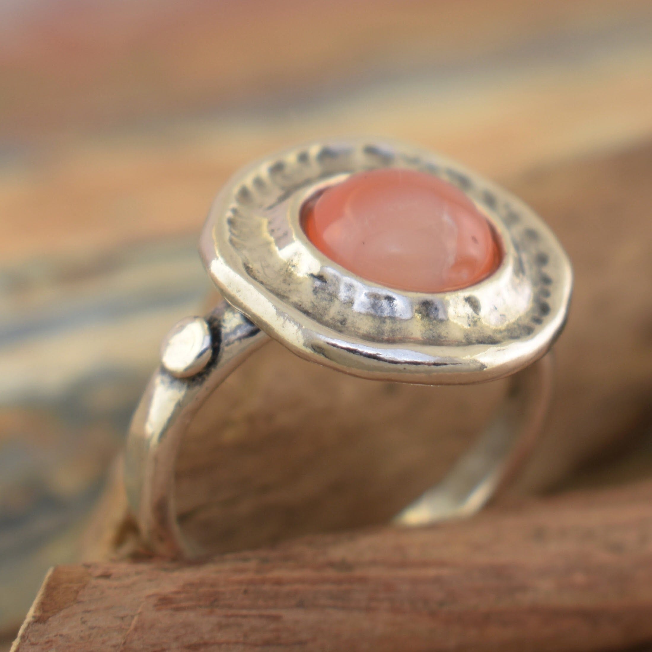 Orange You Glad Ring with an Orange Opal Stone in the center of a handcrafted sterling silver ring