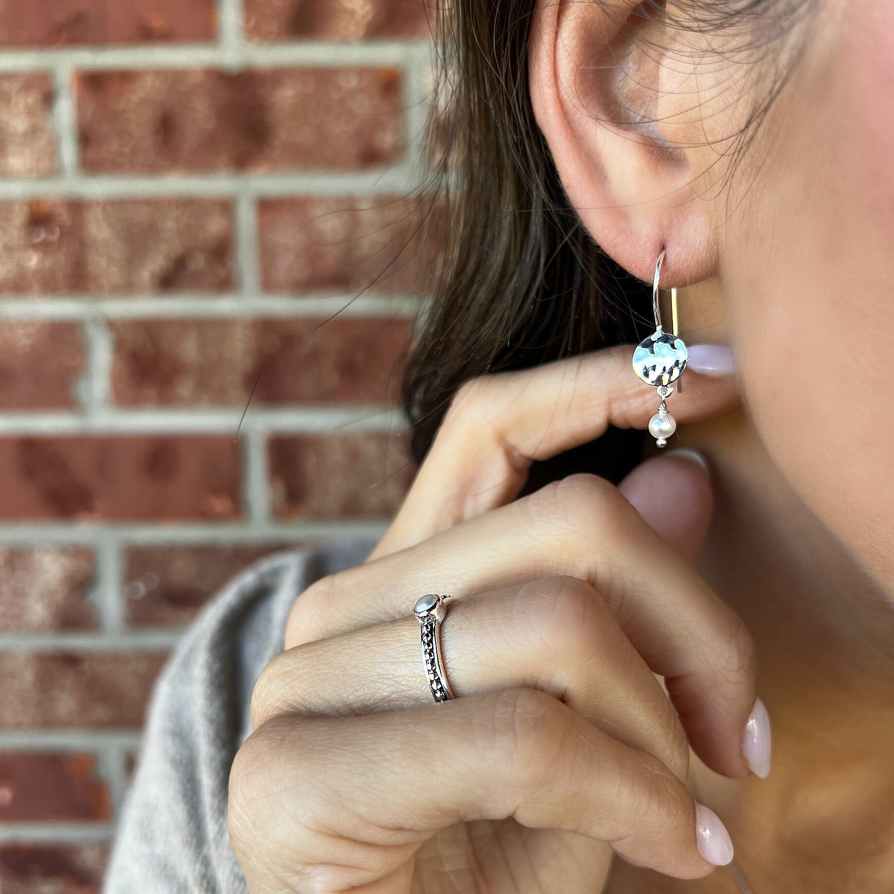 sterling silver hammered earring with a dangling pearl