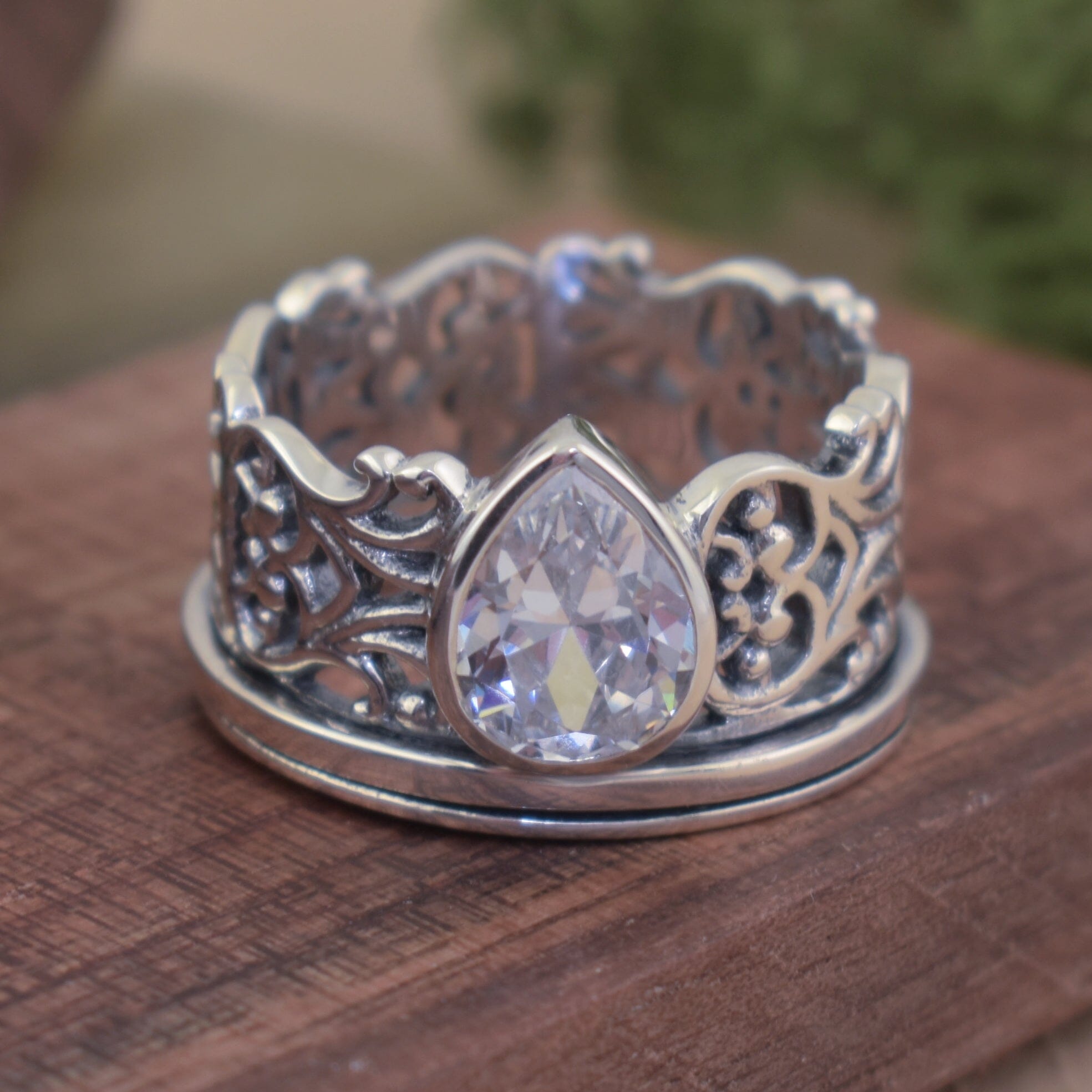 Designer filigree ring featuring pear-shaped clear cubic zirconia