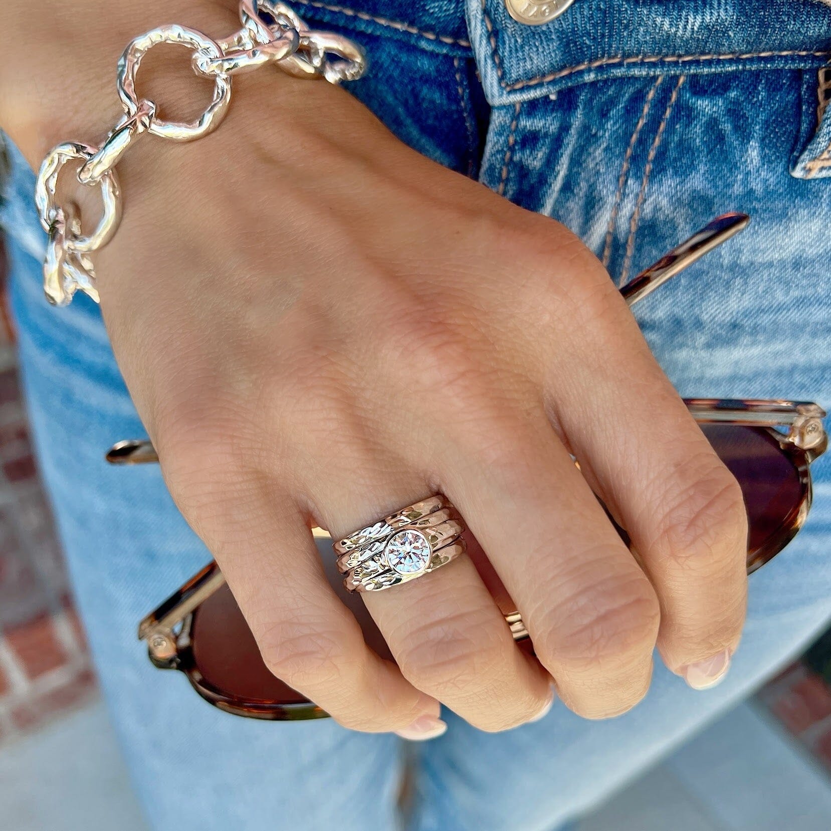 sterling silver clear cz ring with several hammered bands combined into one