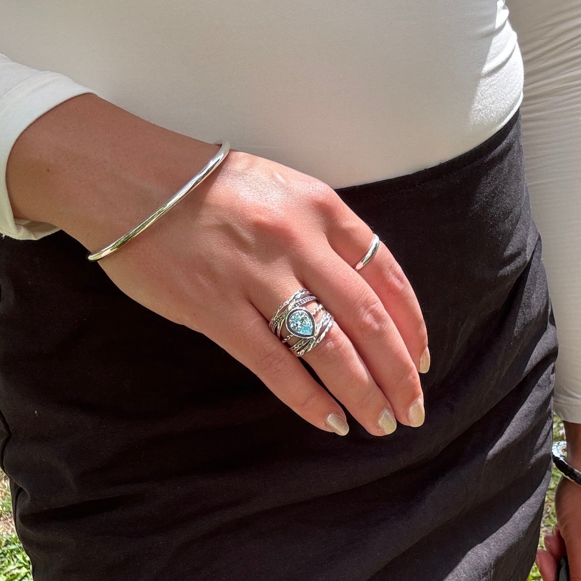 teardrop shaped sky blue cubic zirconia ring prong-set in a sterling silver band