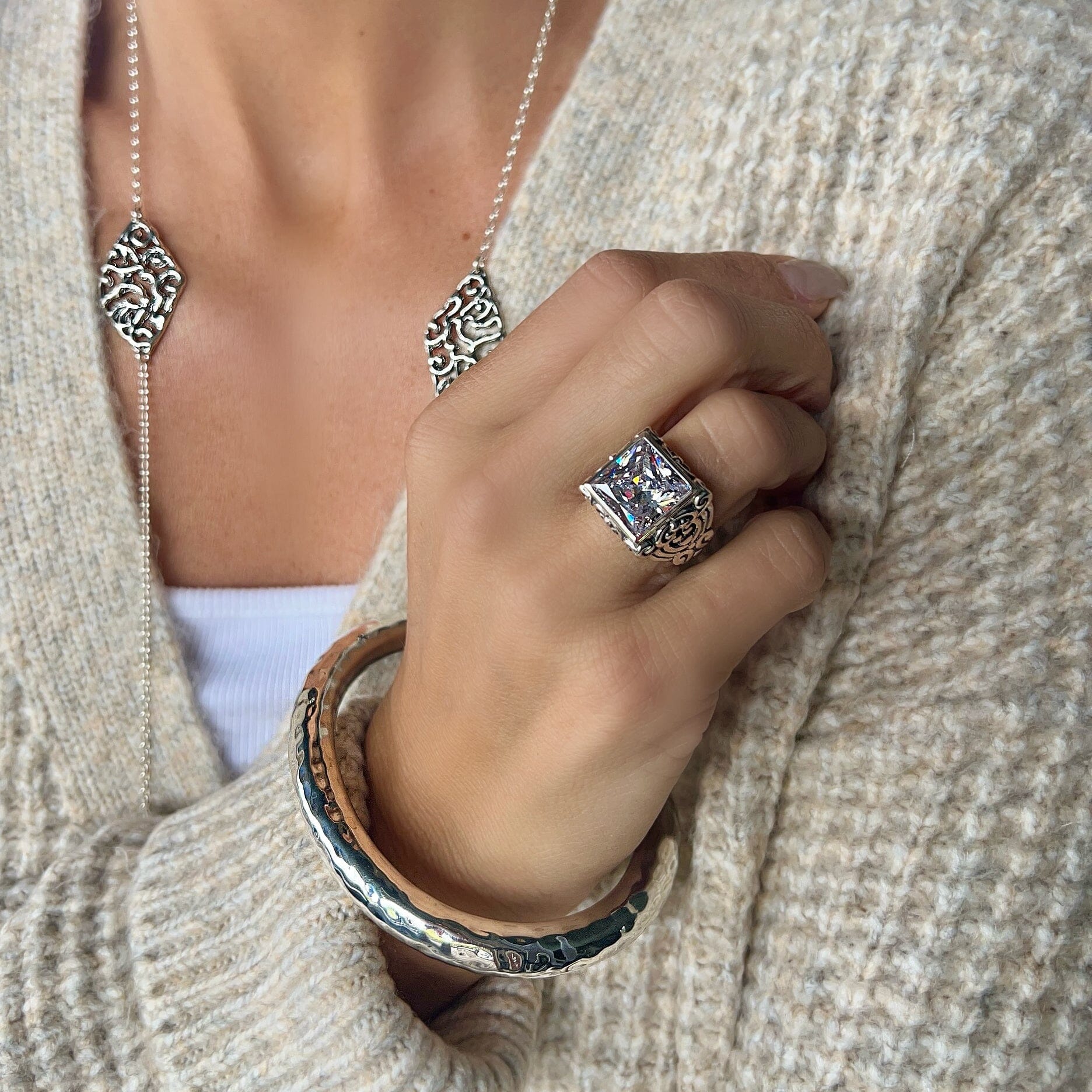 .925 ring with a swirl band paired with the sonoma bangle and the cassie necklace