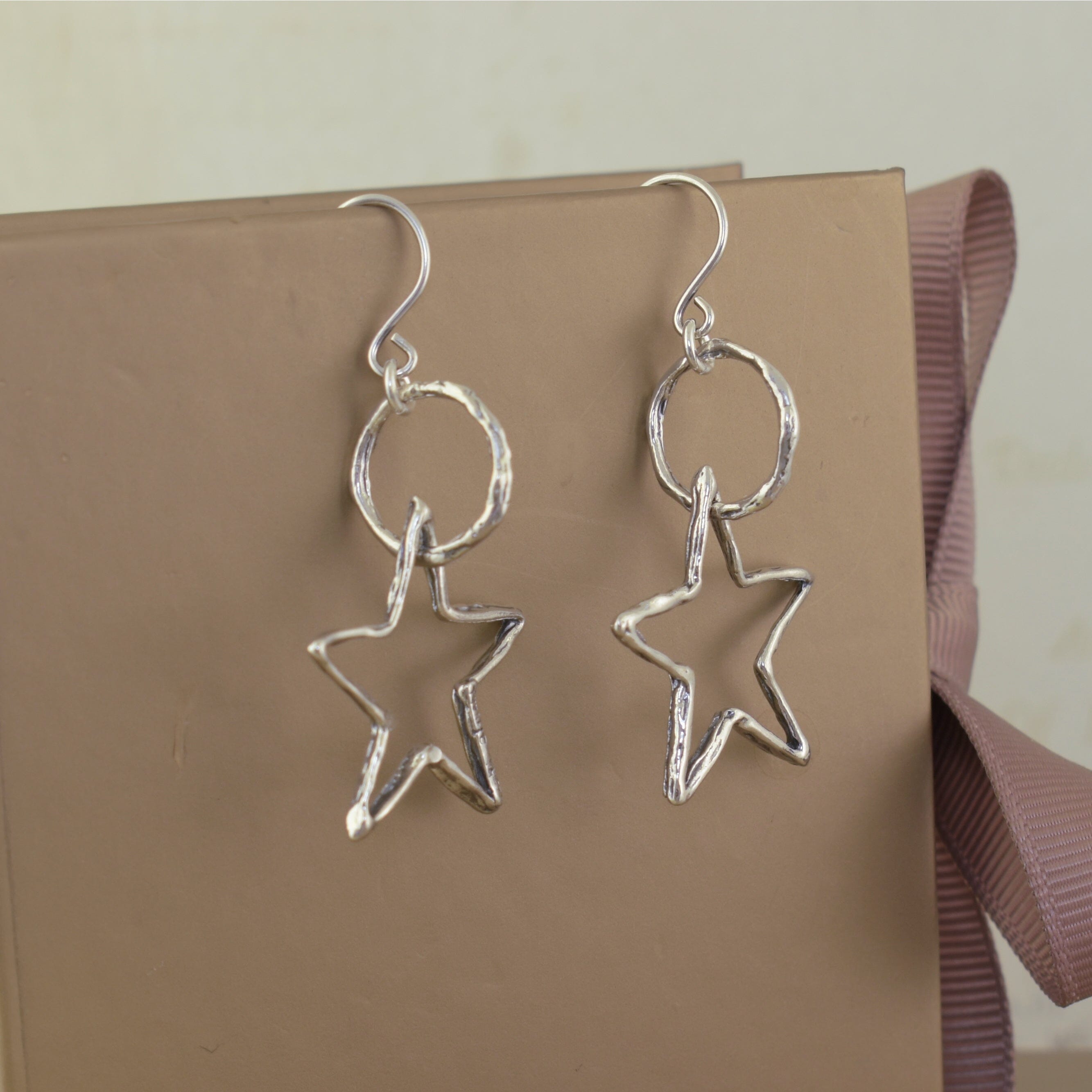 Silver star-shaped earrings in handcrafted sterling silver