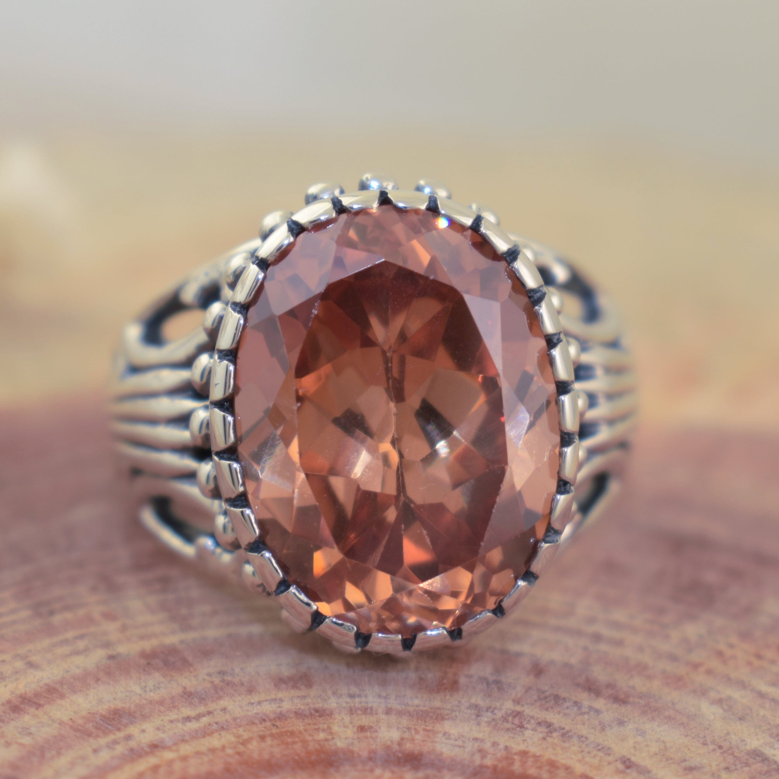Handcrafted sterling silver ring with large oval champagne stone