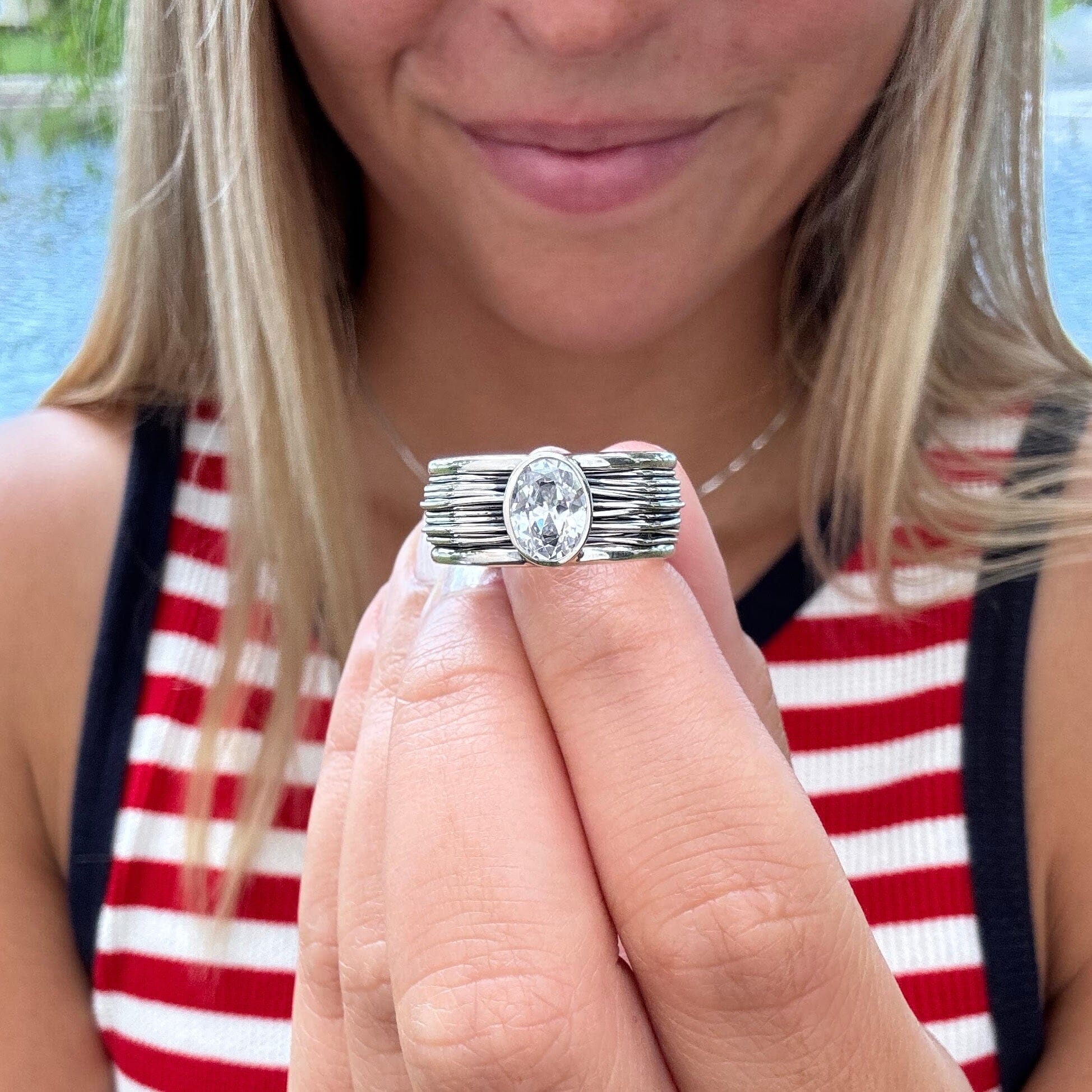 sterling silver wire style ring with an oval cz center