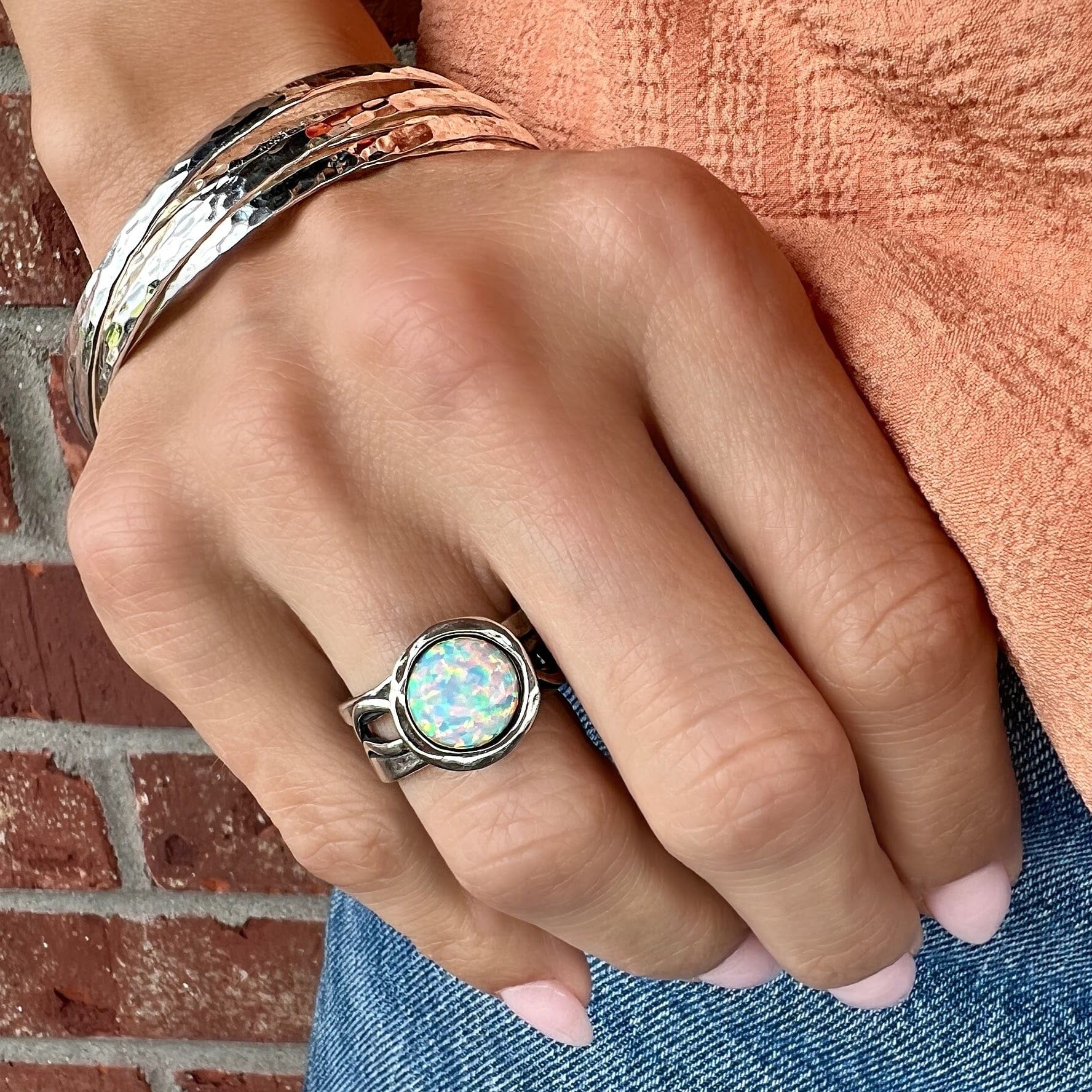 sterling silver ring with an opal stone paired with the falls bangle