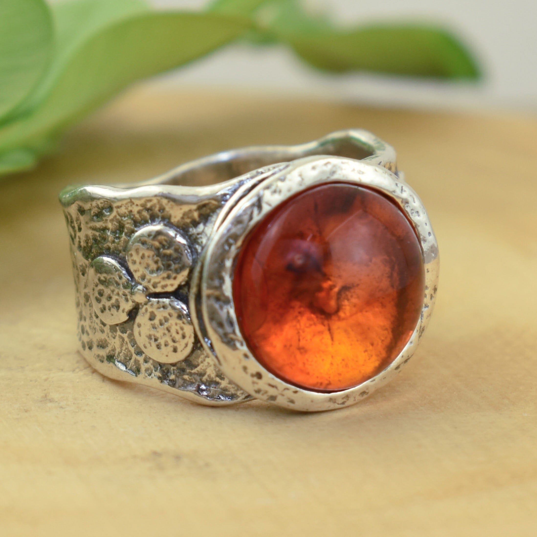 Handcrafted sterling silver ring with round synthetic amber stone