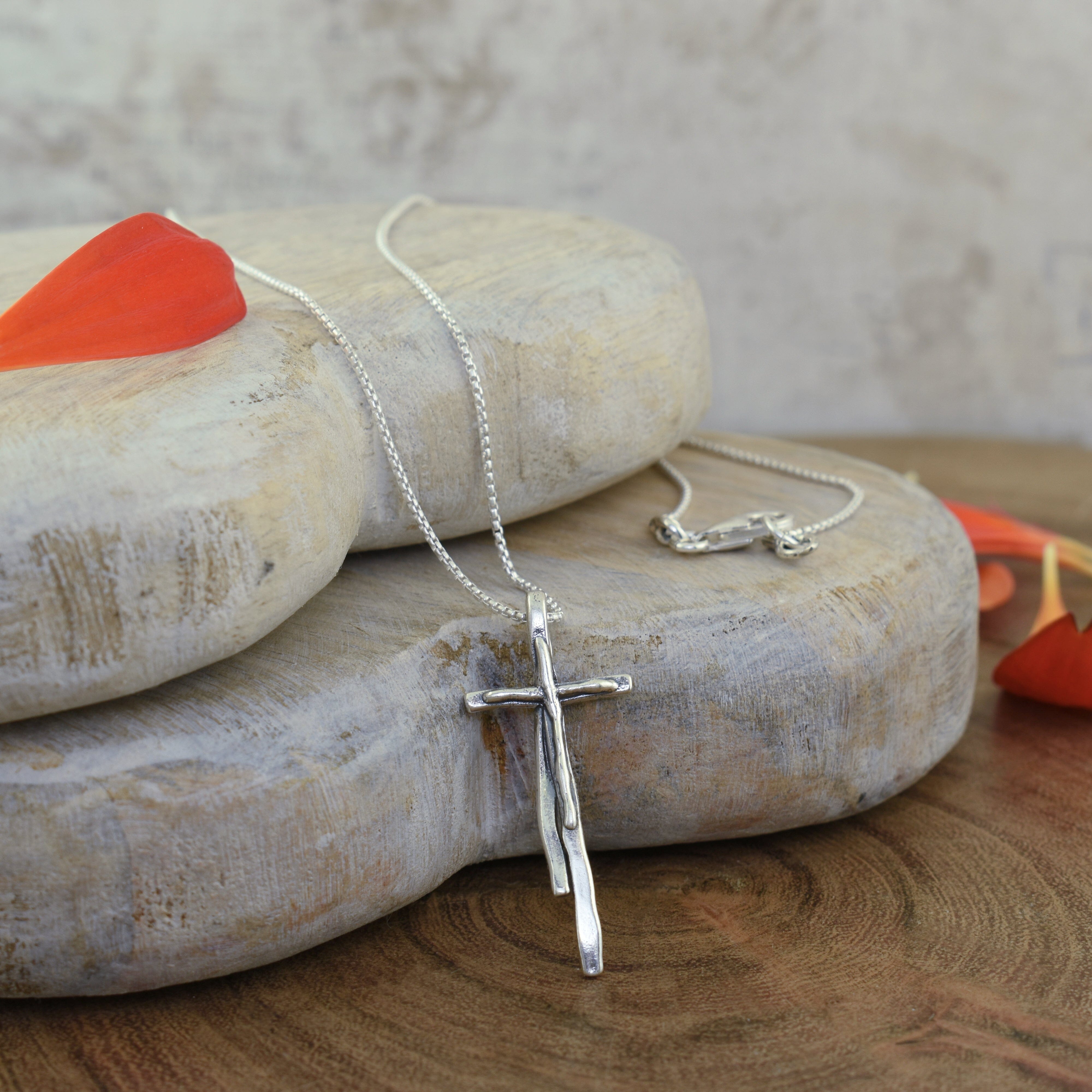 sterling silver cross necklace with an organic style