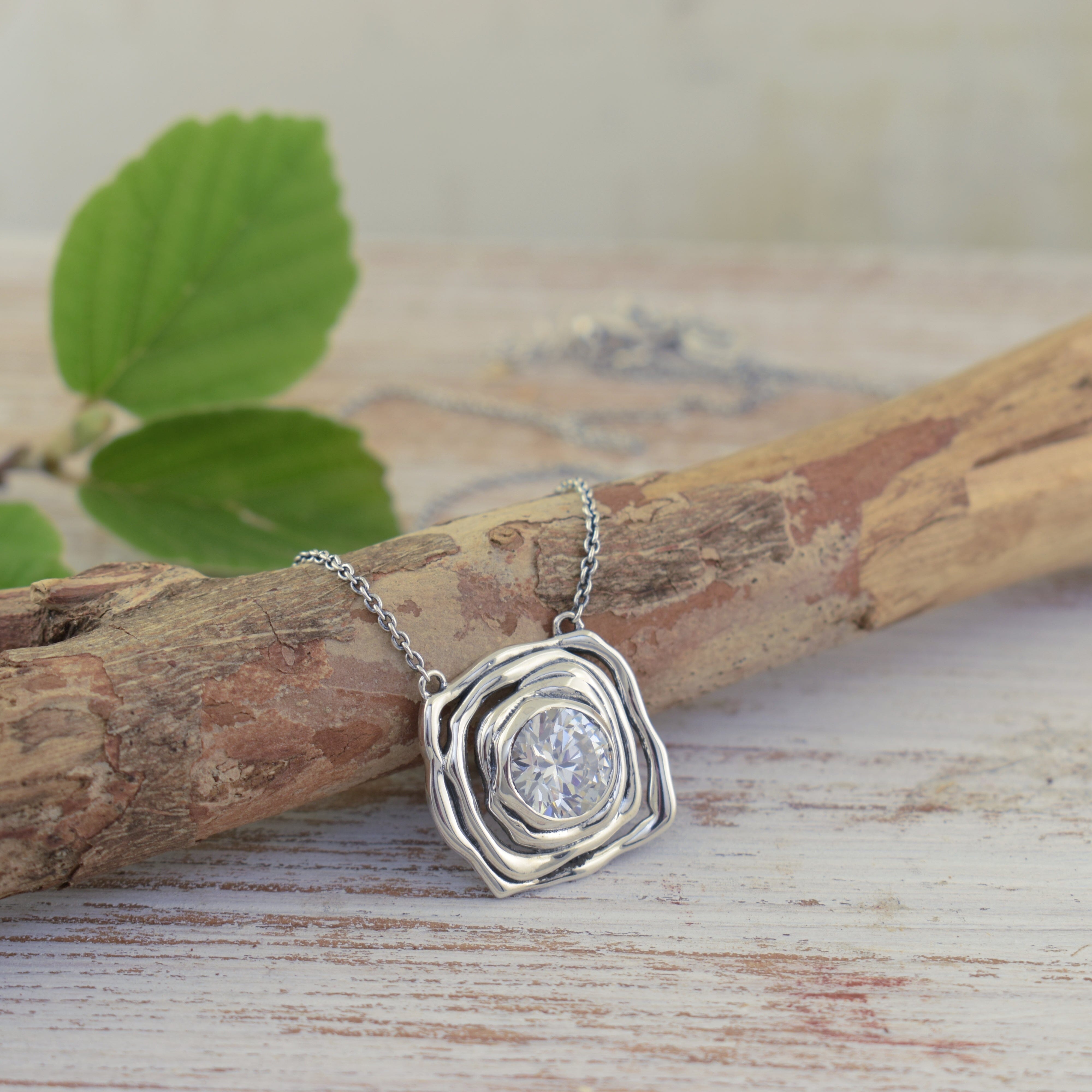 handcrafted sterling silver necklace with round cubic zirconia bling