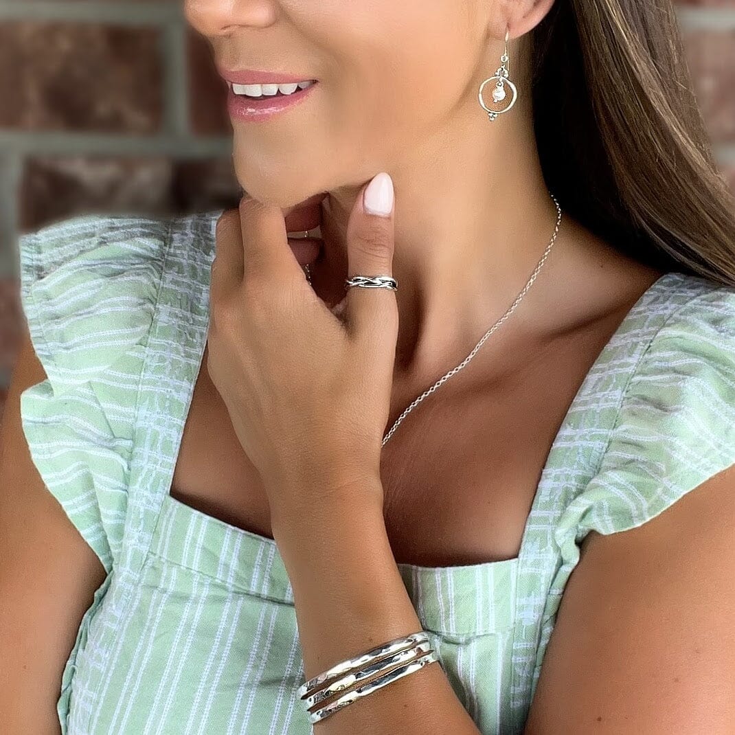 Plot Twist Ring featured with Pearl Portrait earrings and Off The Cuff bracelet
