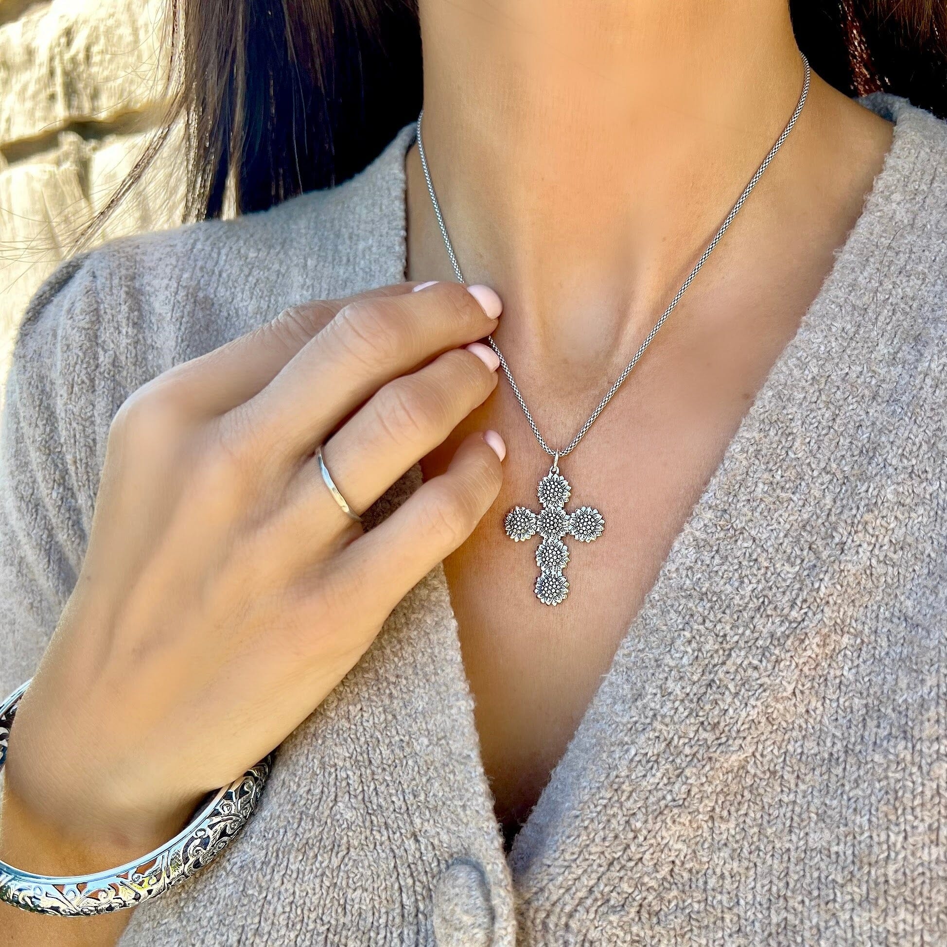 Sonflower cross necklace paired with sterling vineyard bracelet and plain silver stack ring