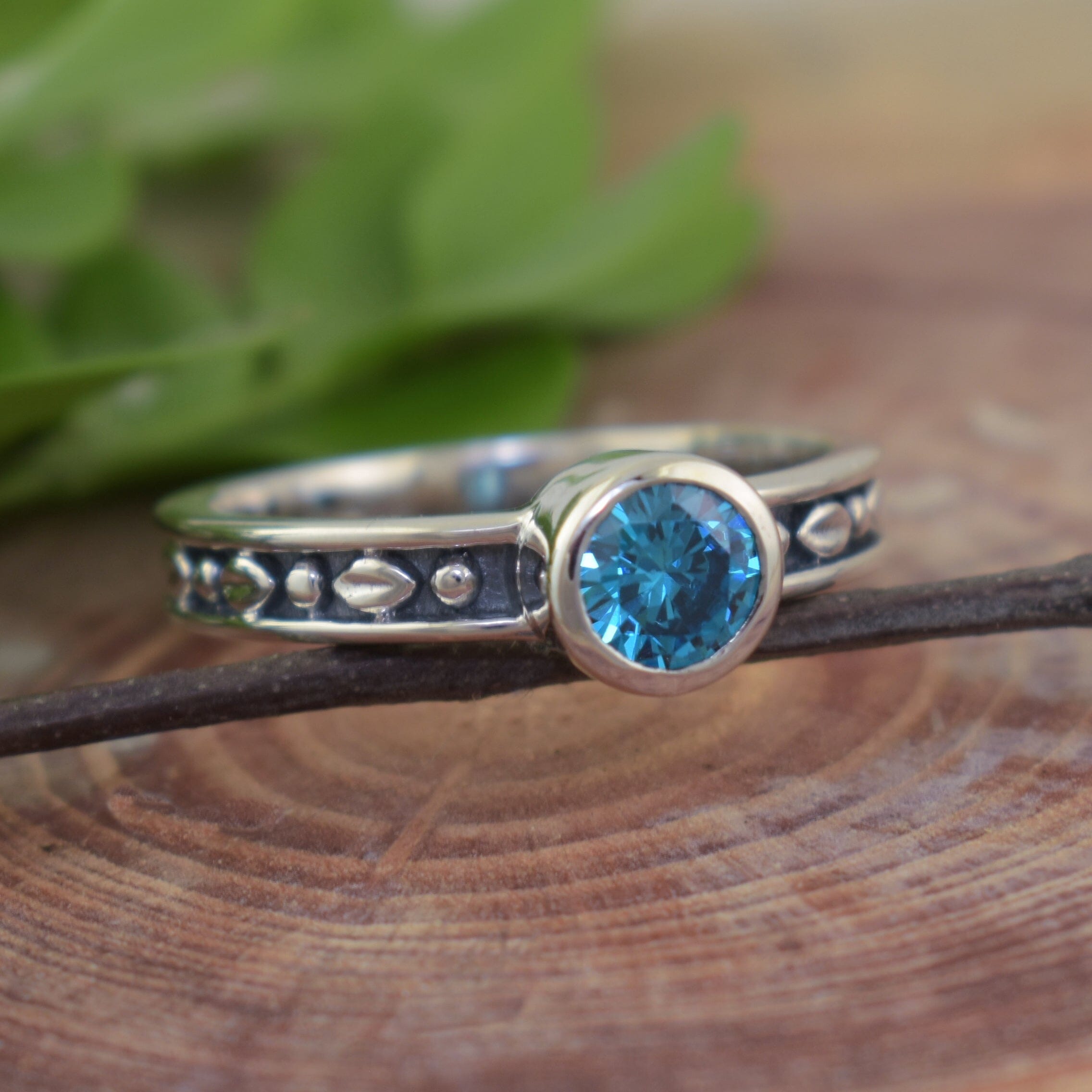Blue stone ring featuring high polished and antique sterling silver