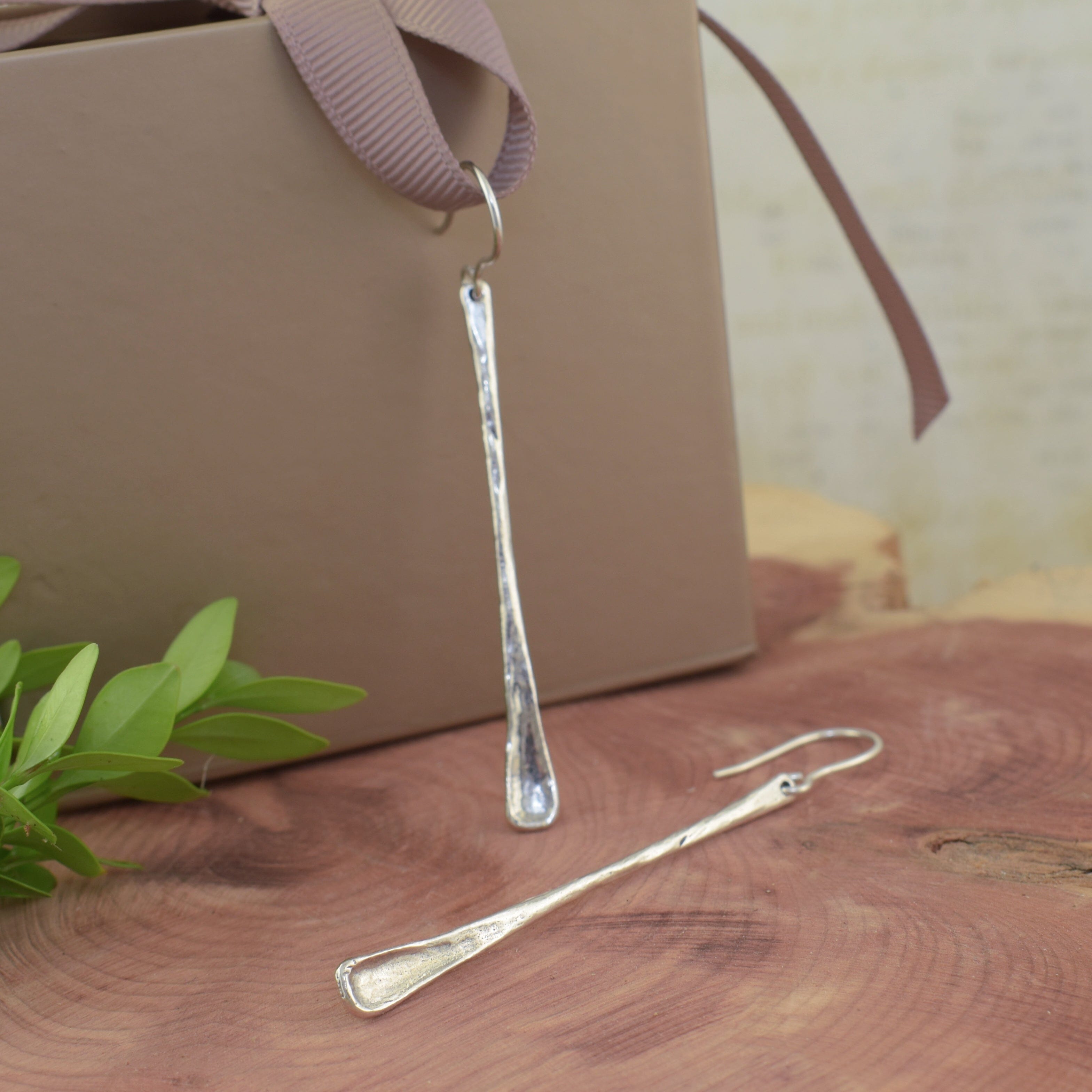 long silver bar earrings with an organic finish
