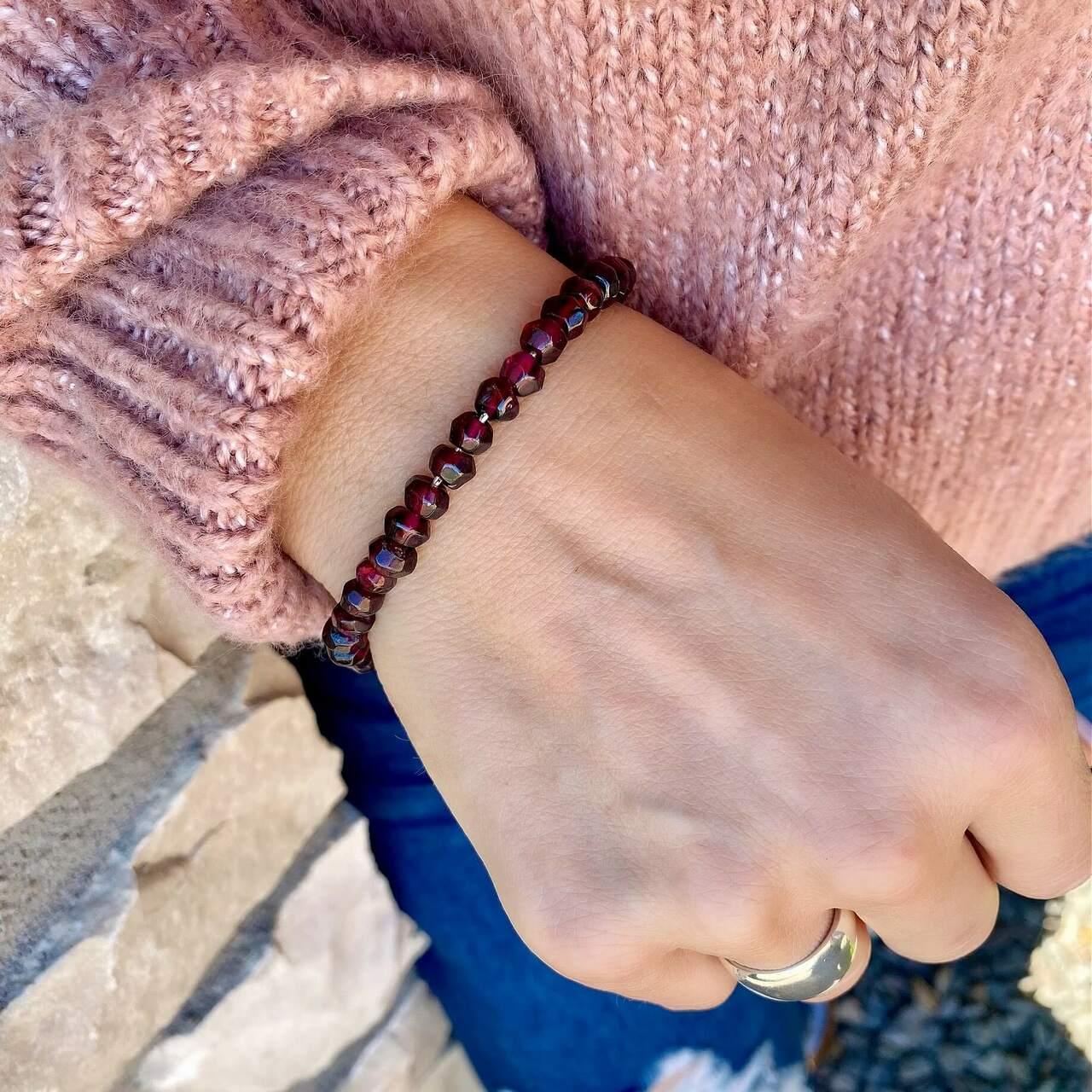 Designer bracelet in sterling silver with garnet stones