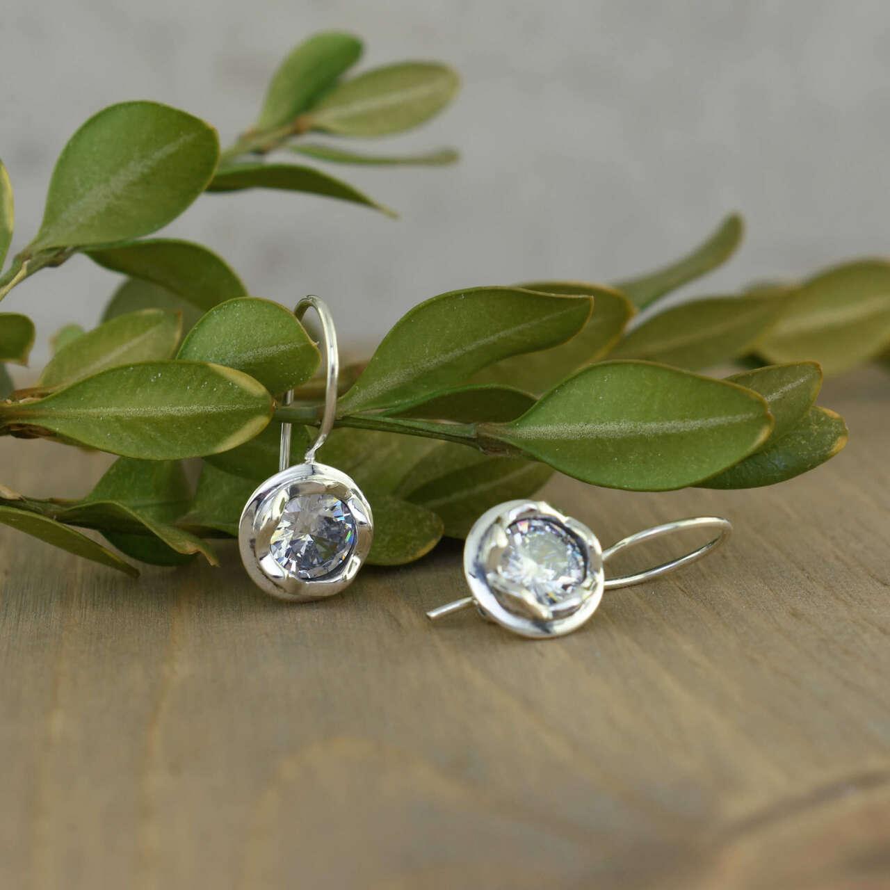 Handcrafted sterling silver earrings with faceted CZ