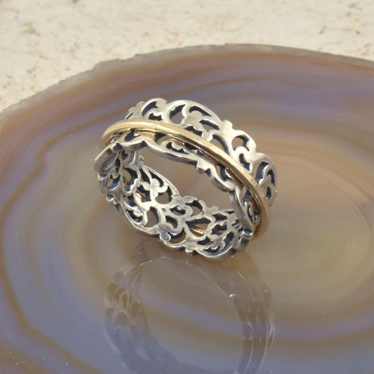 Handcrafted sterling silver ring with a gold filled spinner