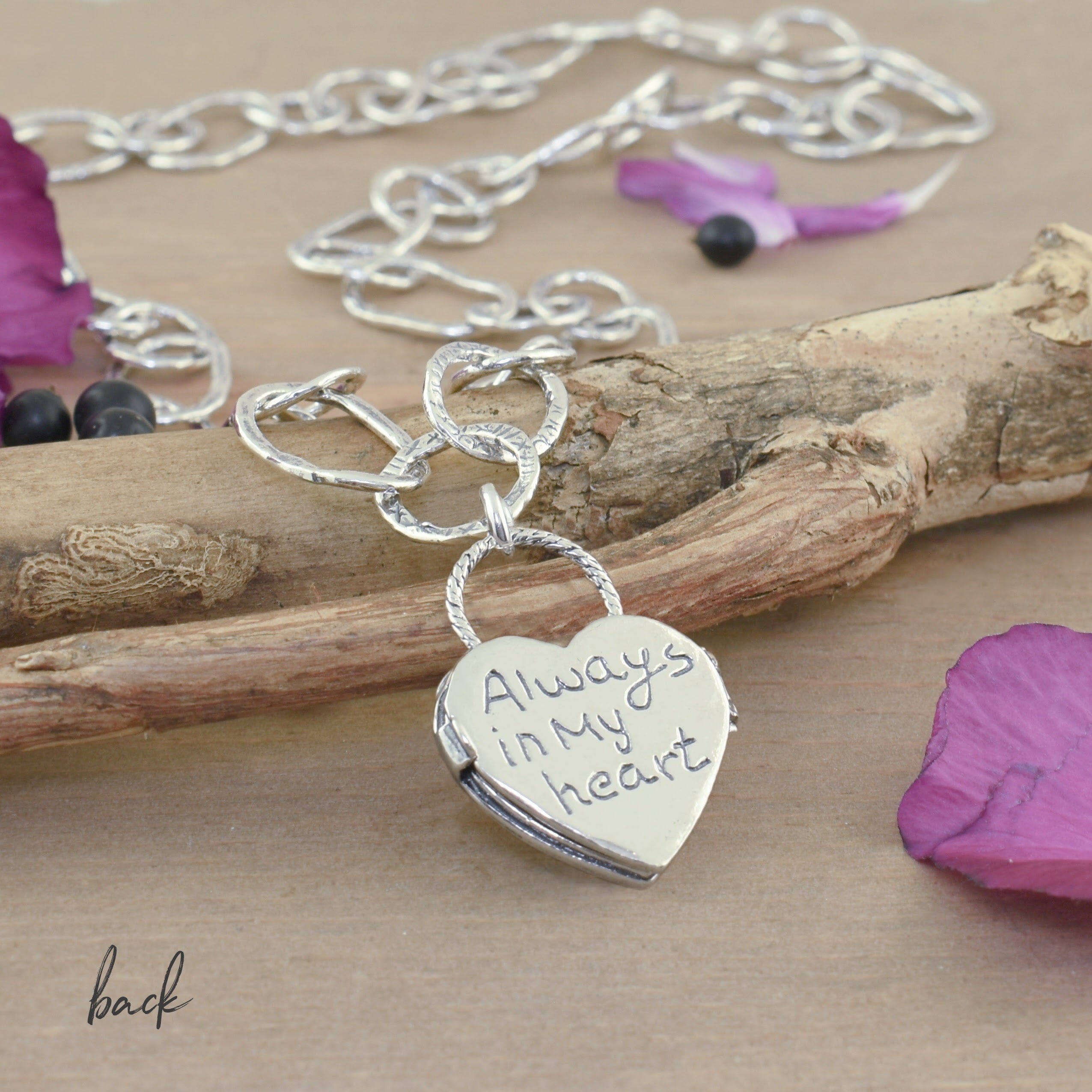 heart locket necklace with "always in my heart" engraved on the back