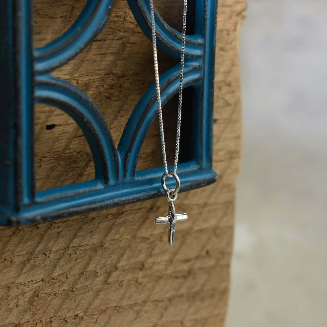 Handcrafted sterling silver cross necklace on a 16-inch chain