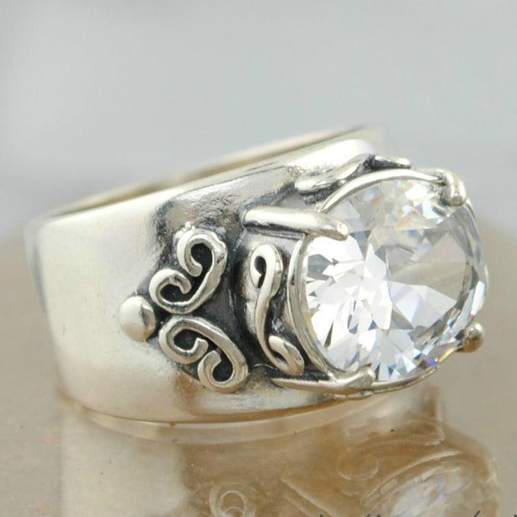 Chunky sterling silver ring with large cz and scroll work on the sides
