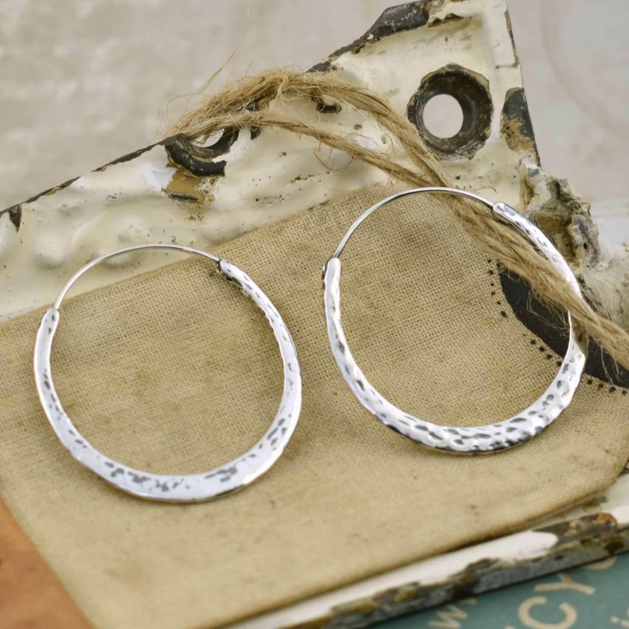 Handcrafted sterling silver earrings in a continuous wire style