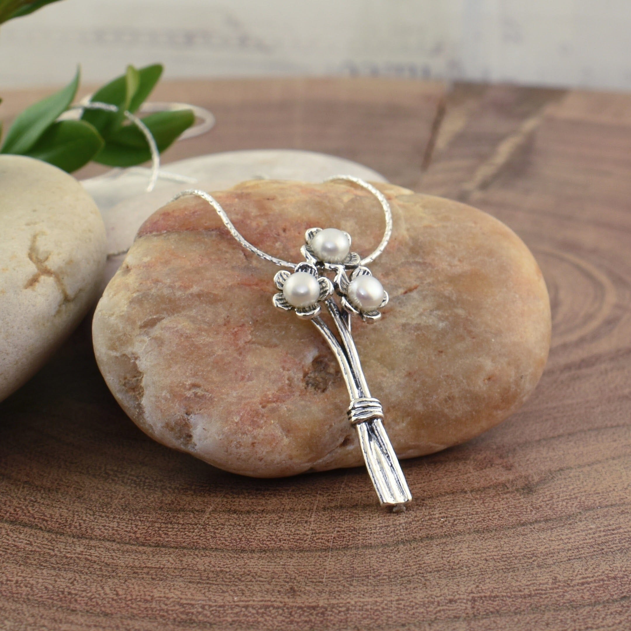 chunky sterling silver hand picked flower necklace featuring three freshwater pearls