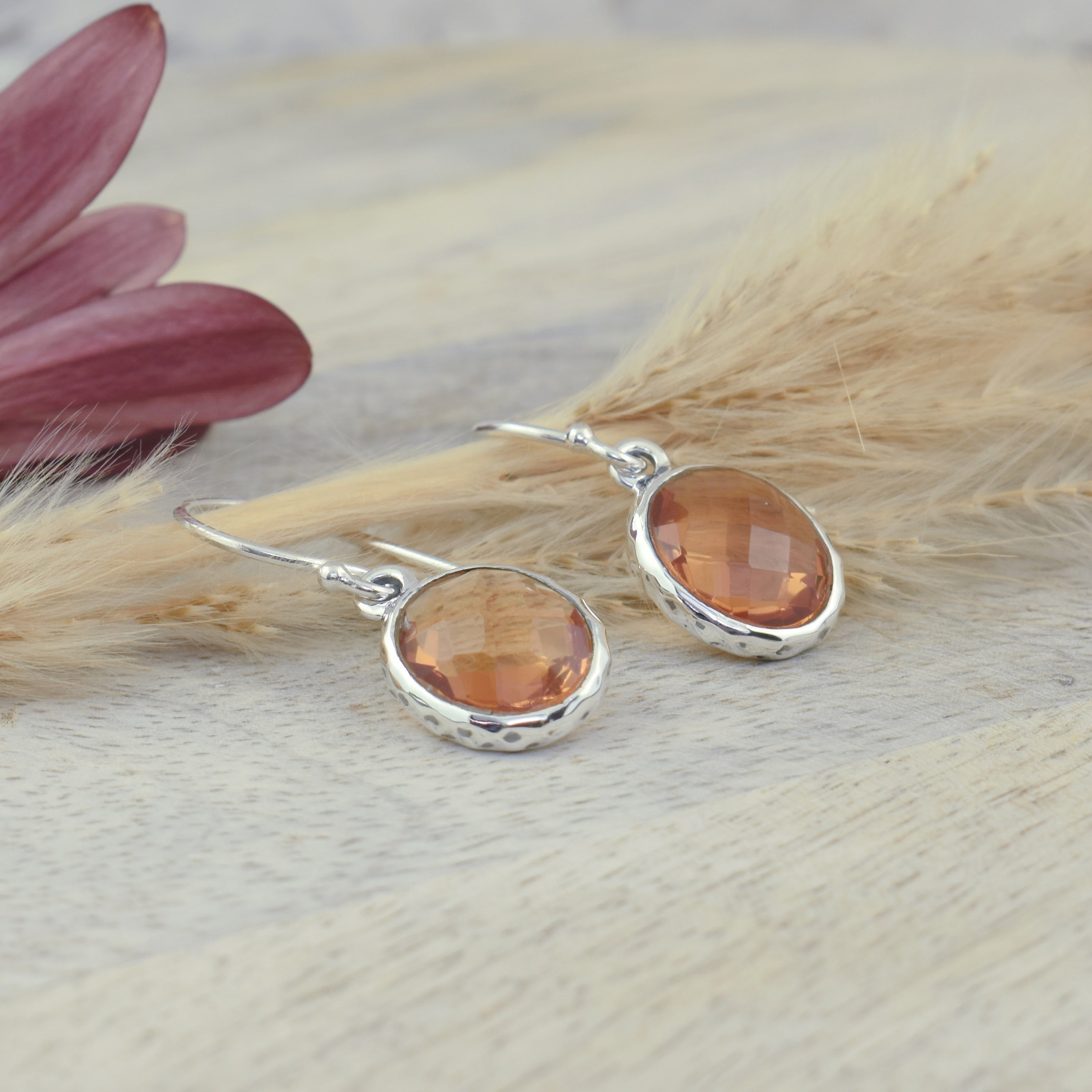 dainty silver earrings with oval amber dangles with a slight hammered finish