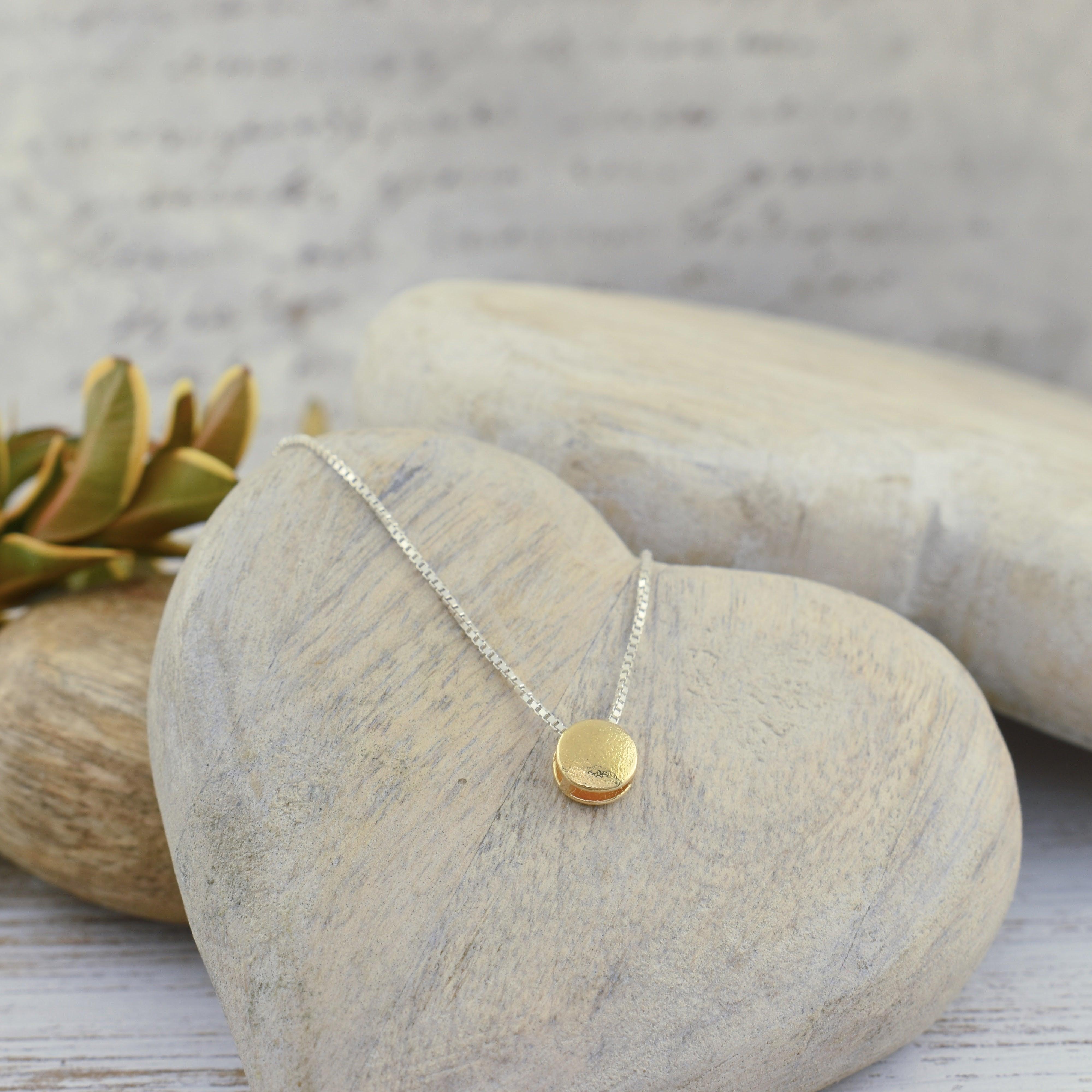 .925 sterling silver necklace with a round gold-filled pendant