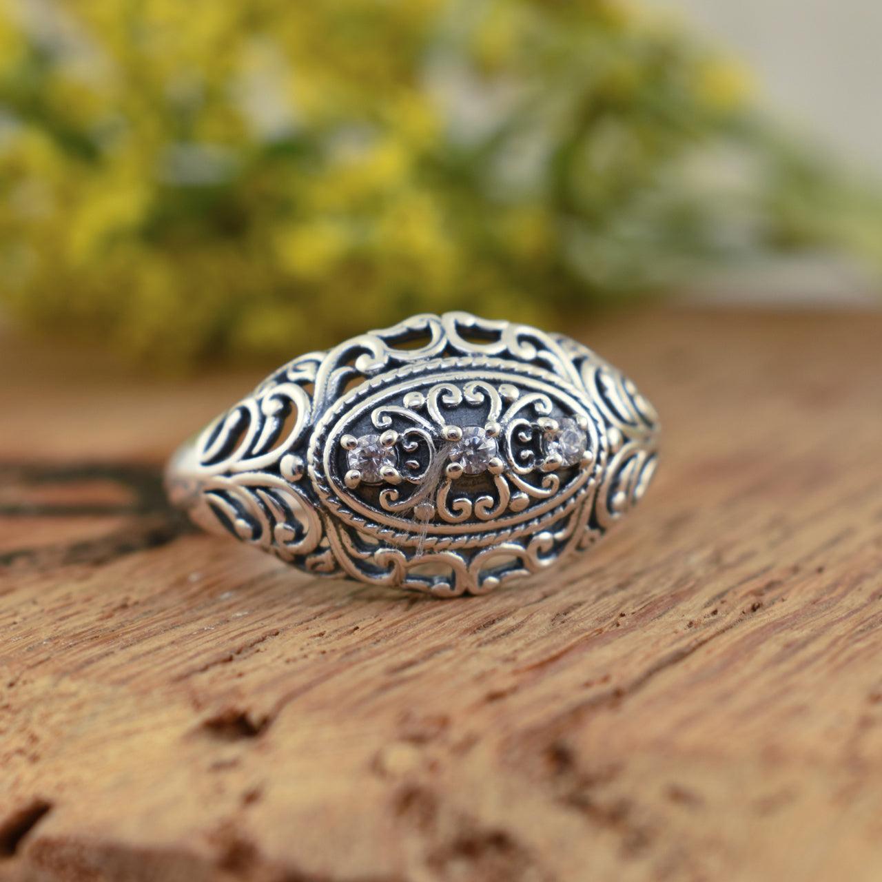 sterling silver antique ring with 3 stones in the center.  Vintage Splendor Ring.