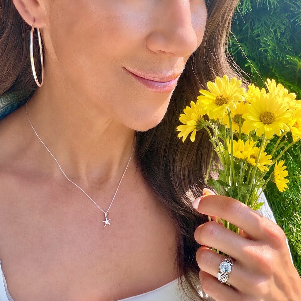 delicate sterling silver necklace featuring a dainty starfish