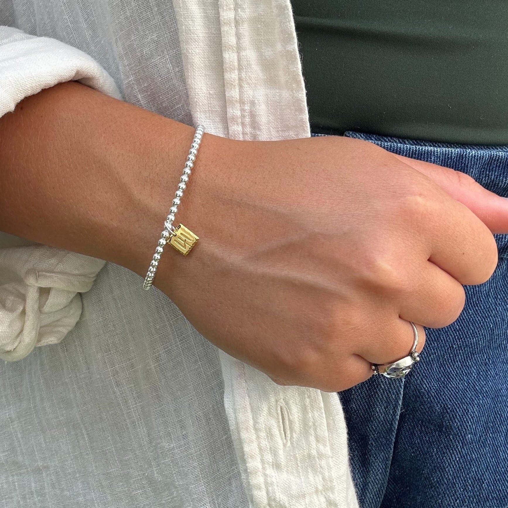 sterling silver beaded cuff featuring a dainty gold plated 41 pendant