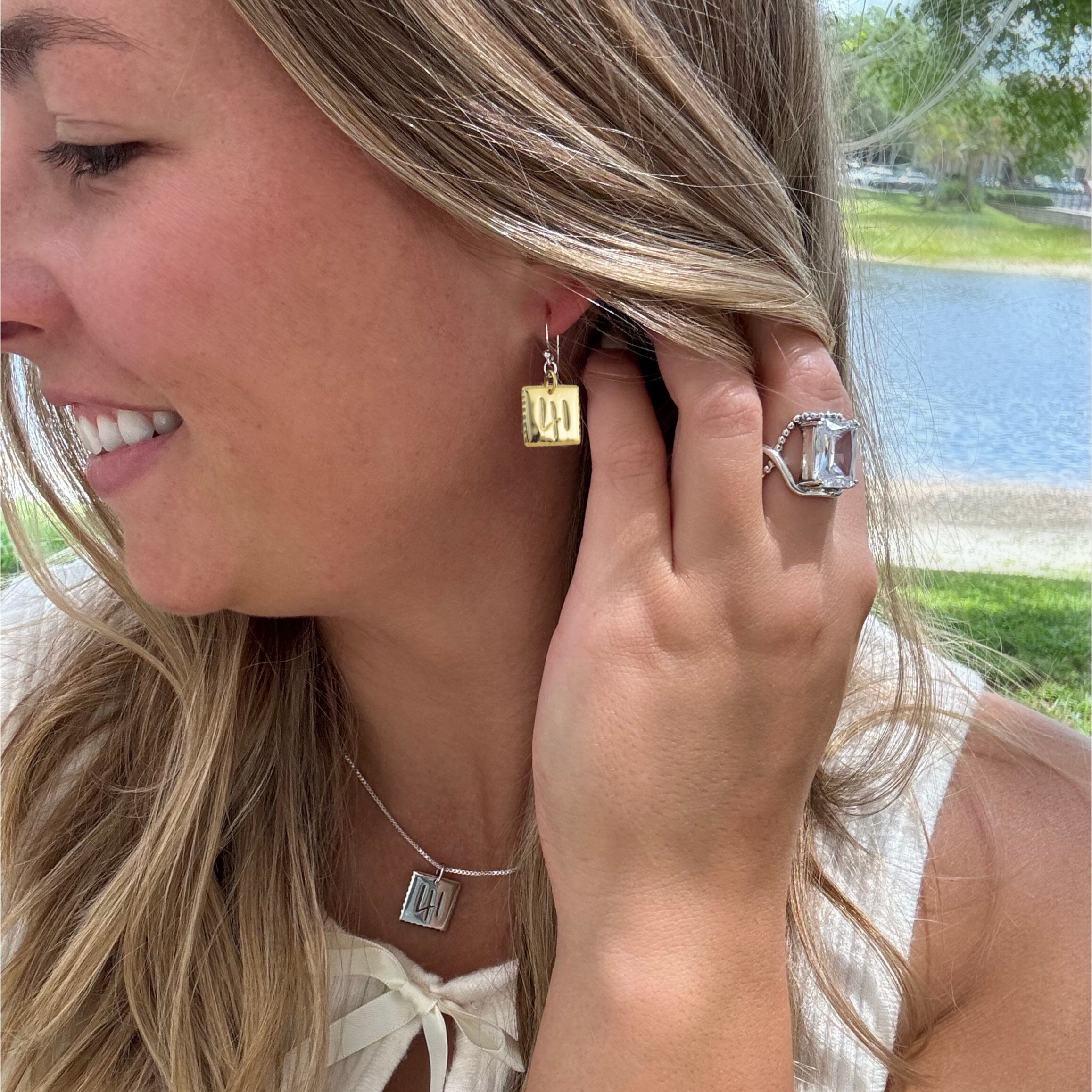 standard sized gold 41 Earrings paired with silver 41 Necklace and Clear cut Ring