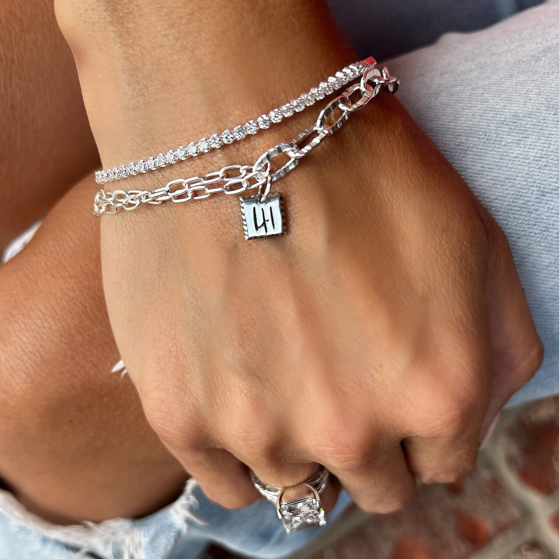 sterling silver paperclip bracelet paired with the tennis bracelet and the ledged ring