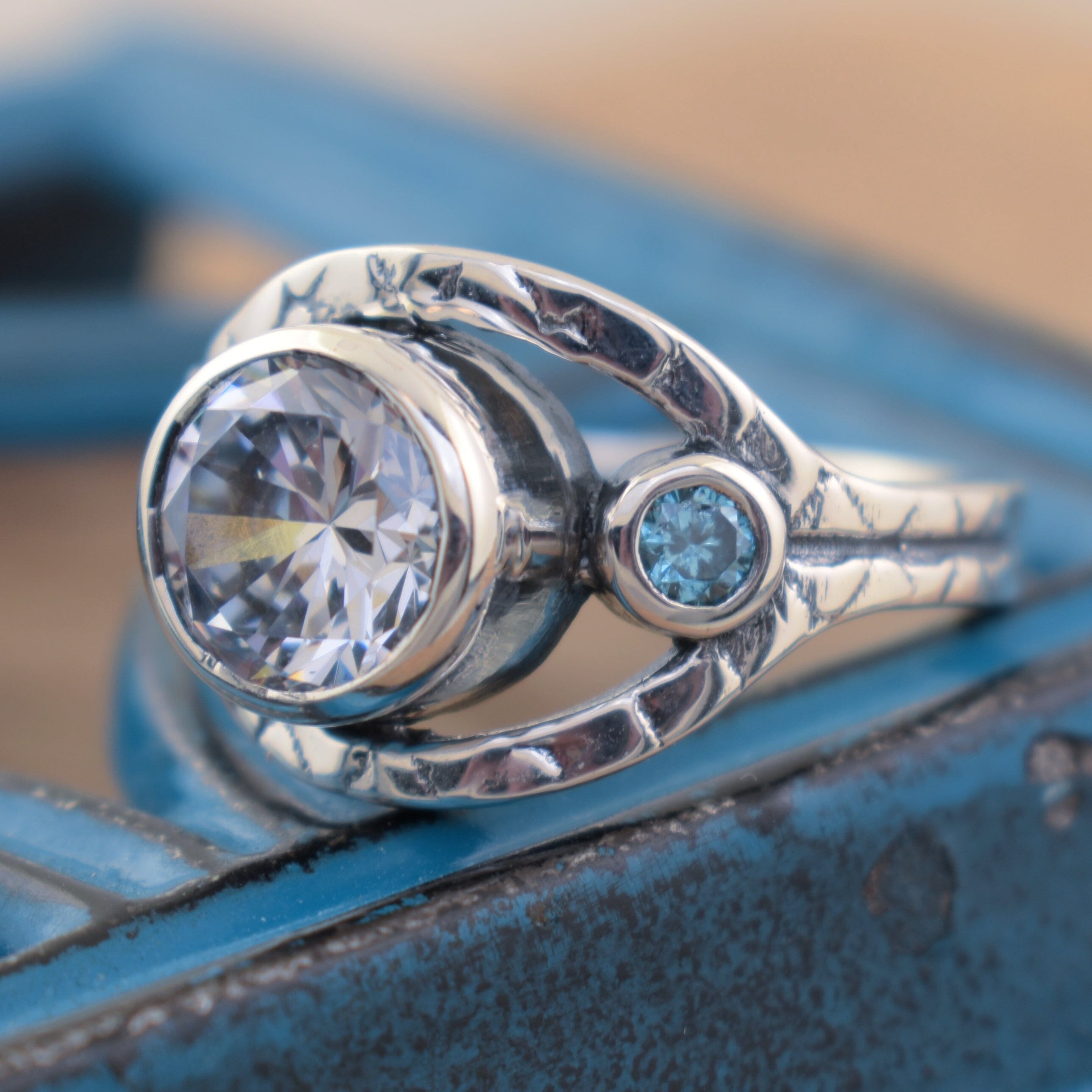 Designer sterling silver ring with blue and clear stones