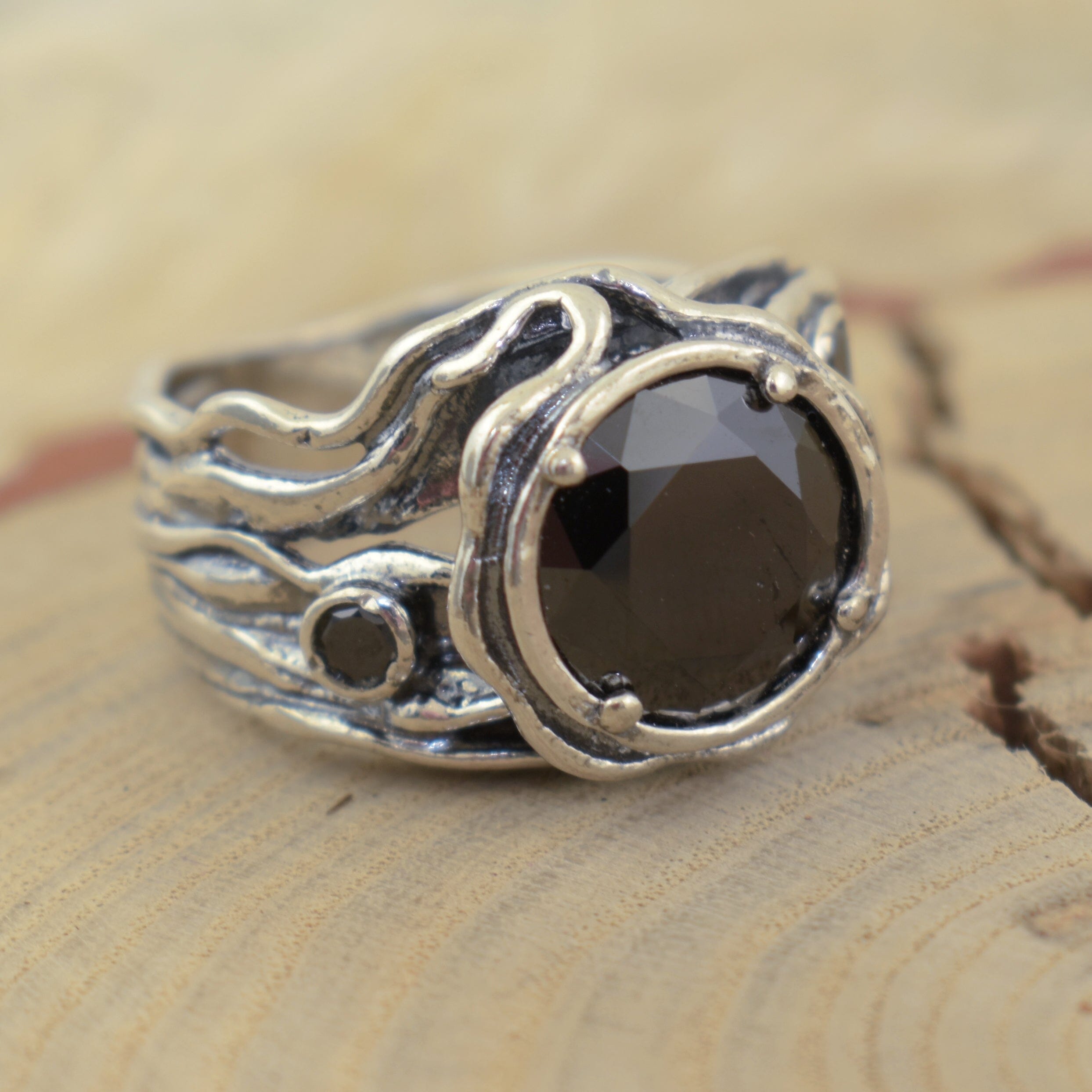 Handcrafted sterling silver ring with black stones